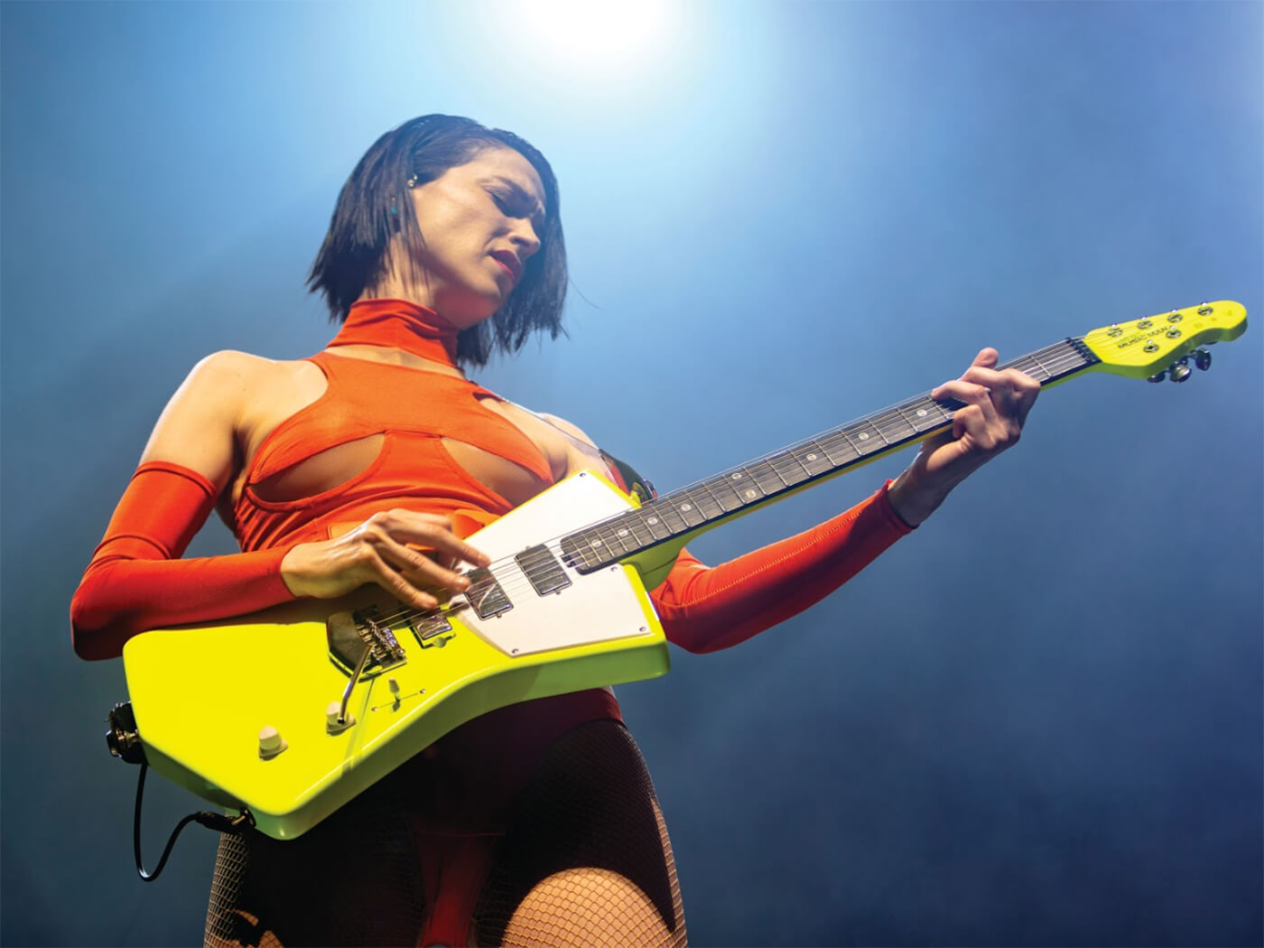 St. Vincent with yellow ernie ball signature model