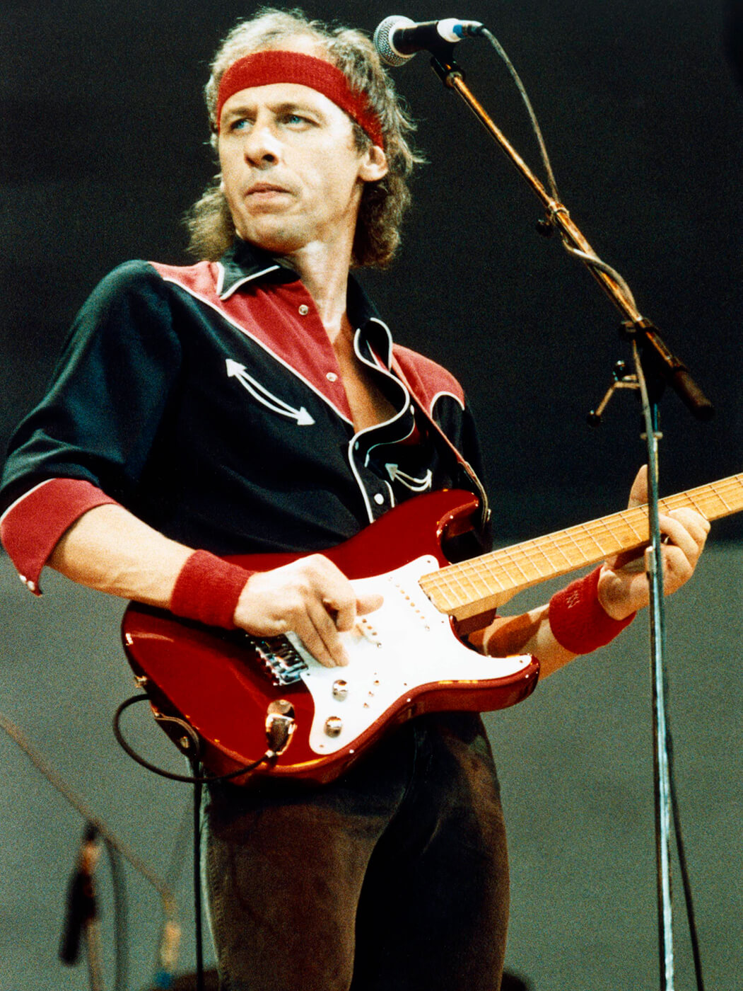 Young Mark Knopfler playingred strat