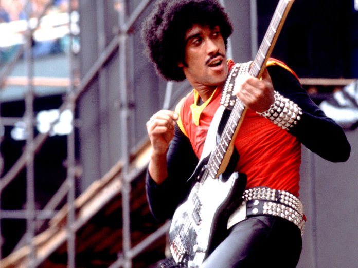 Thin Lizzy's Phil Lynott performing on stage.