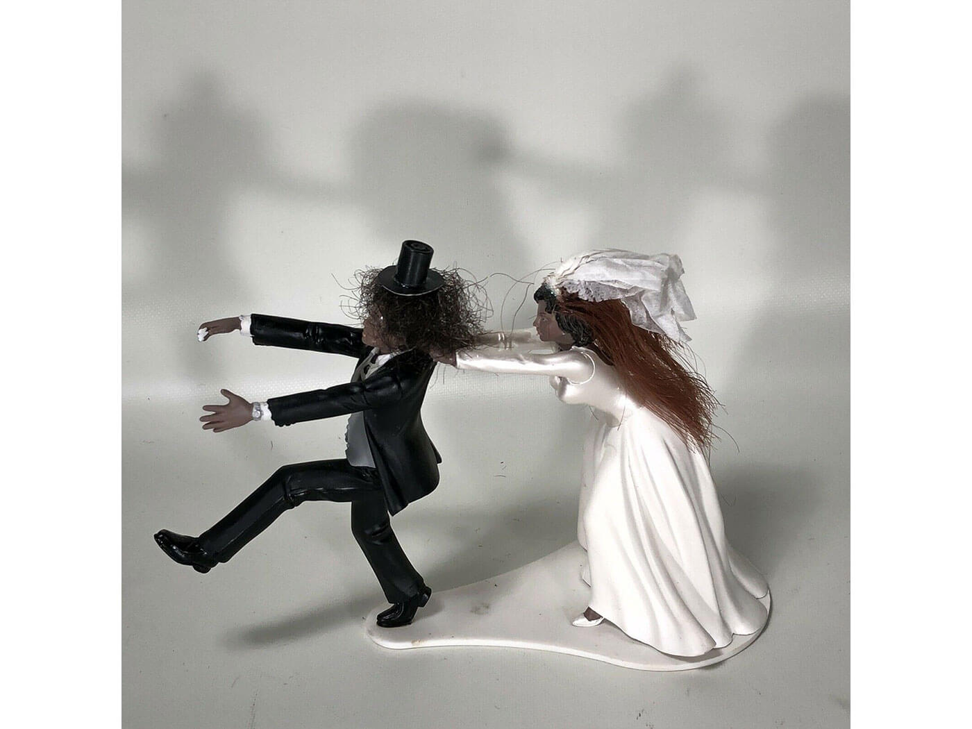 Slash's wedding cake topper, made with human hair.