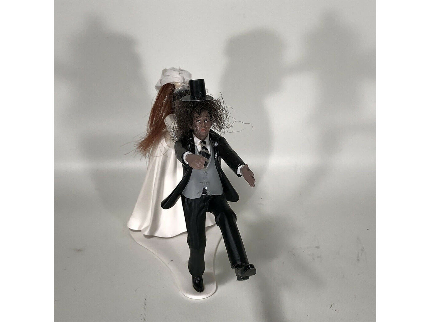 Slash's wedding cake topper, made with human hair.