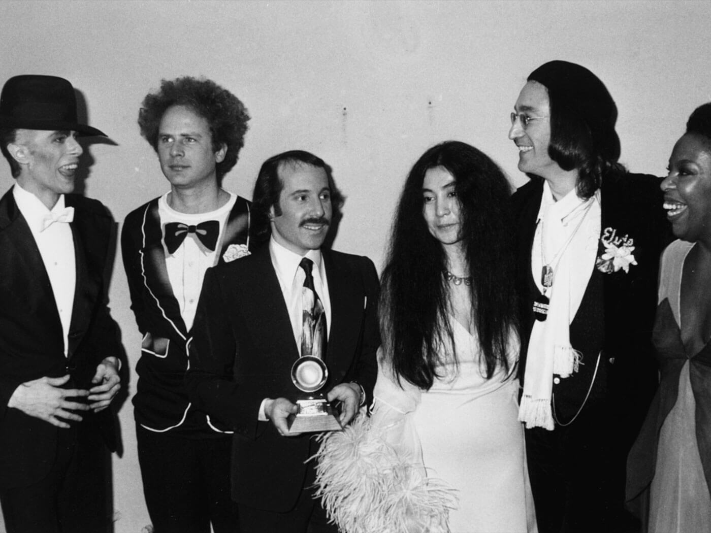 (L-R) David Bowie, Art Garfunkel, Paul Simon, Yoko Ono, John Lennon and Roberta Flack at the 1975 Grammy Awards