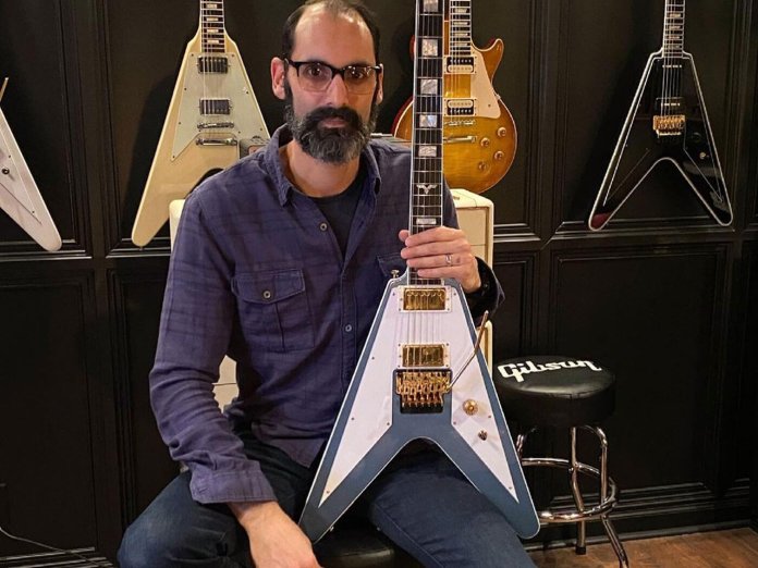 Cesar Gueikian with the Richie Faulkner prototype Gibson Spec