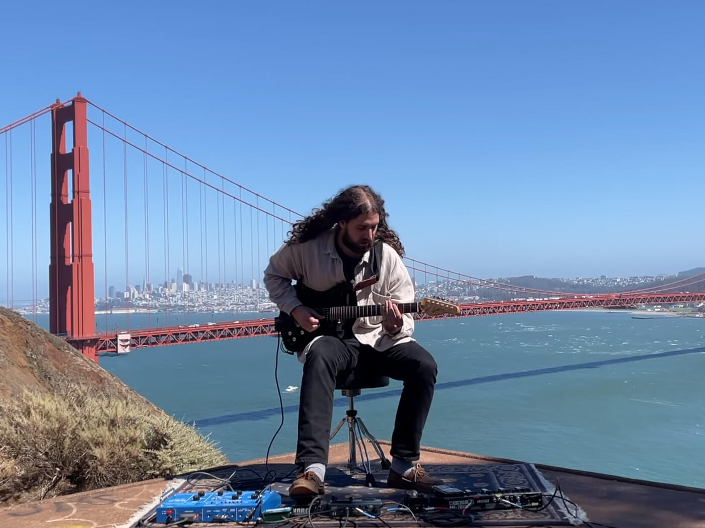 Nate Mercereau performing in front of the Golden Fate Bridge