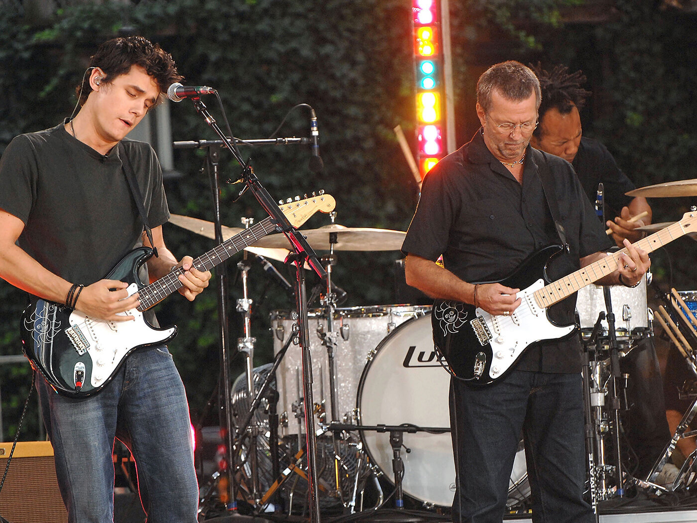 John Mayer and Eric Clapton performing