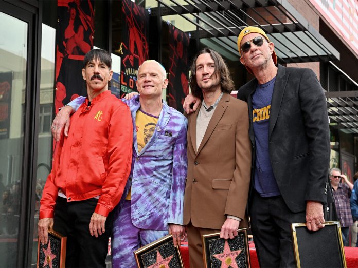 Red Hot Chili Peppers pose with newly re-joined member, John Frusciante