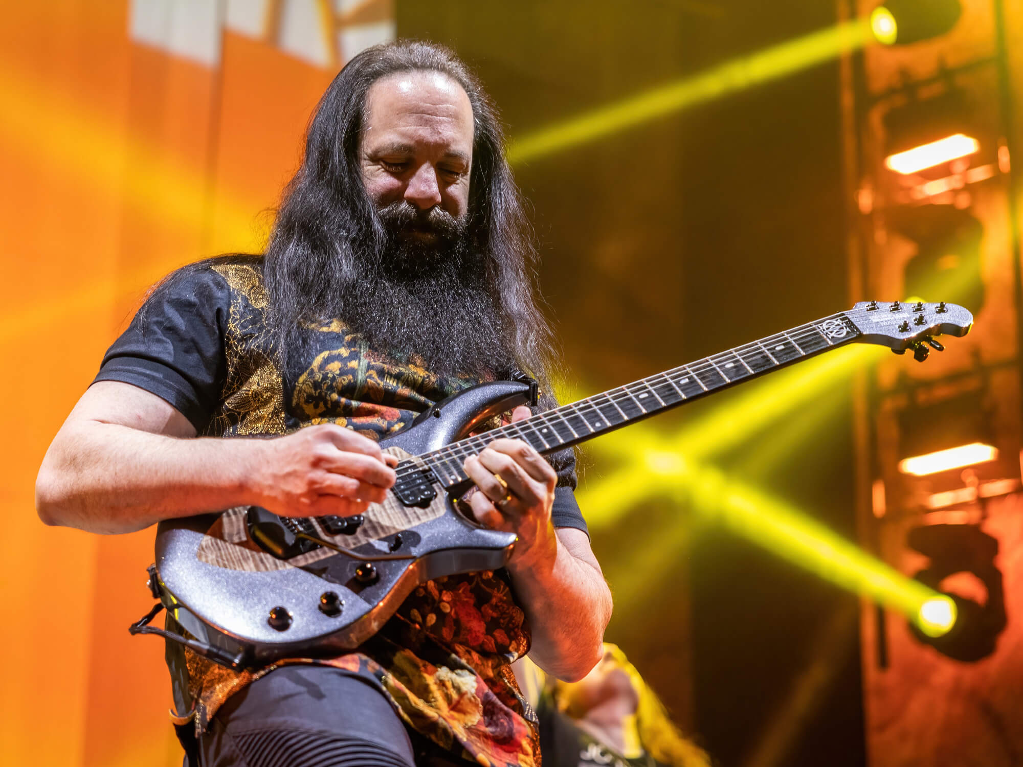 John Petrucci playing his guitar