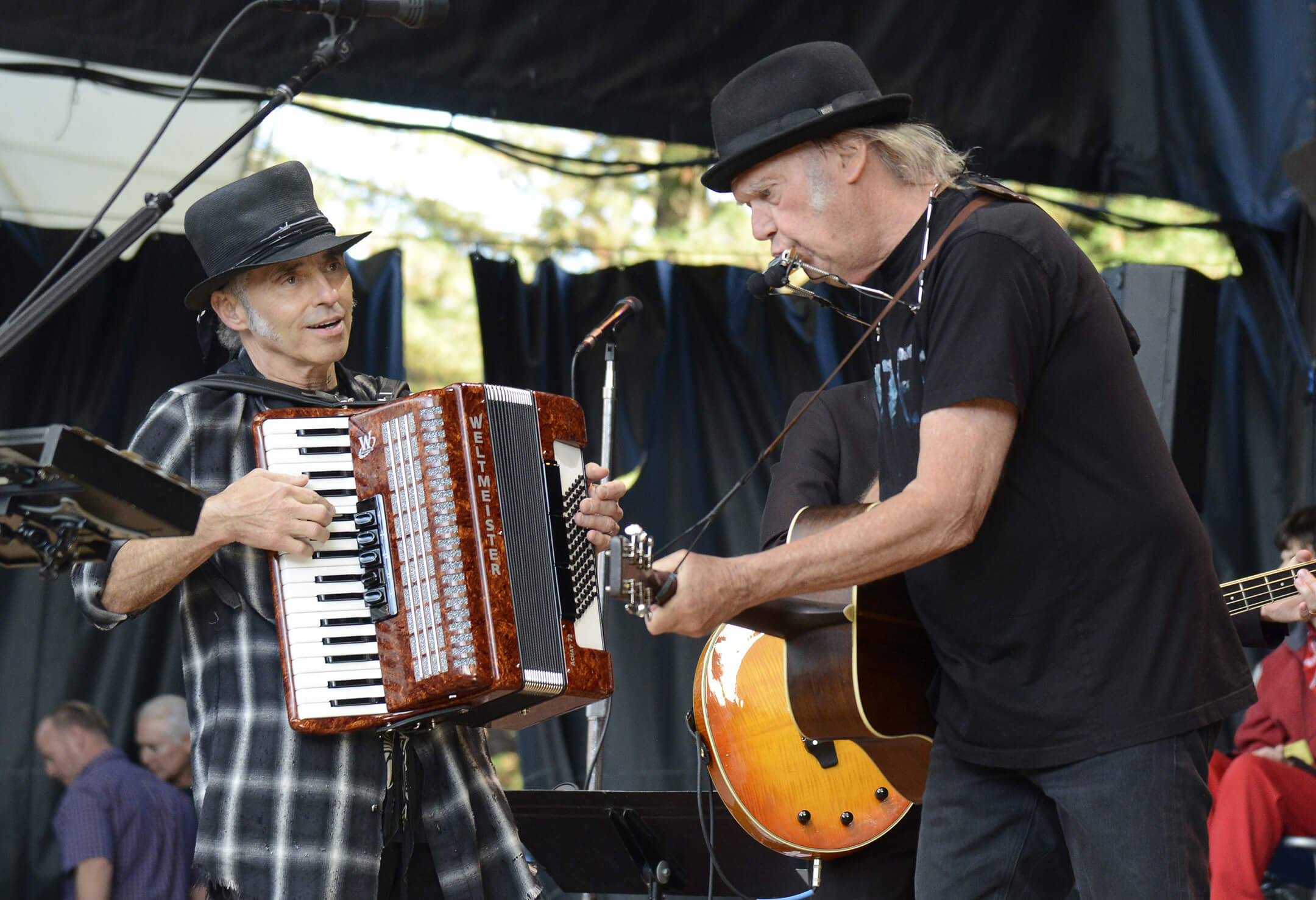 Nils Lofgren and Neil Young perform with My Morning Jacket during the 30th Annual Bridge School Benefit at Shoreline Amphitheatre on October 23, 2016 in Mountain View, California.