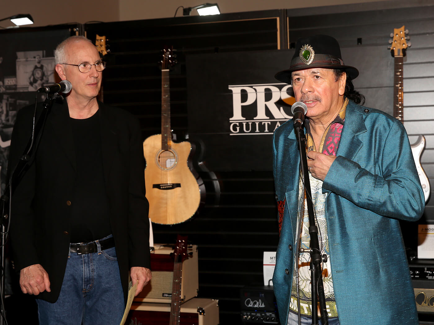 Paul Reed Smith and Carlos Santana speak at the PRS booth during the 2019 NAMM Show opening day at the Anaheim Convention Center on January 24, 2019 in Anaheim, California.