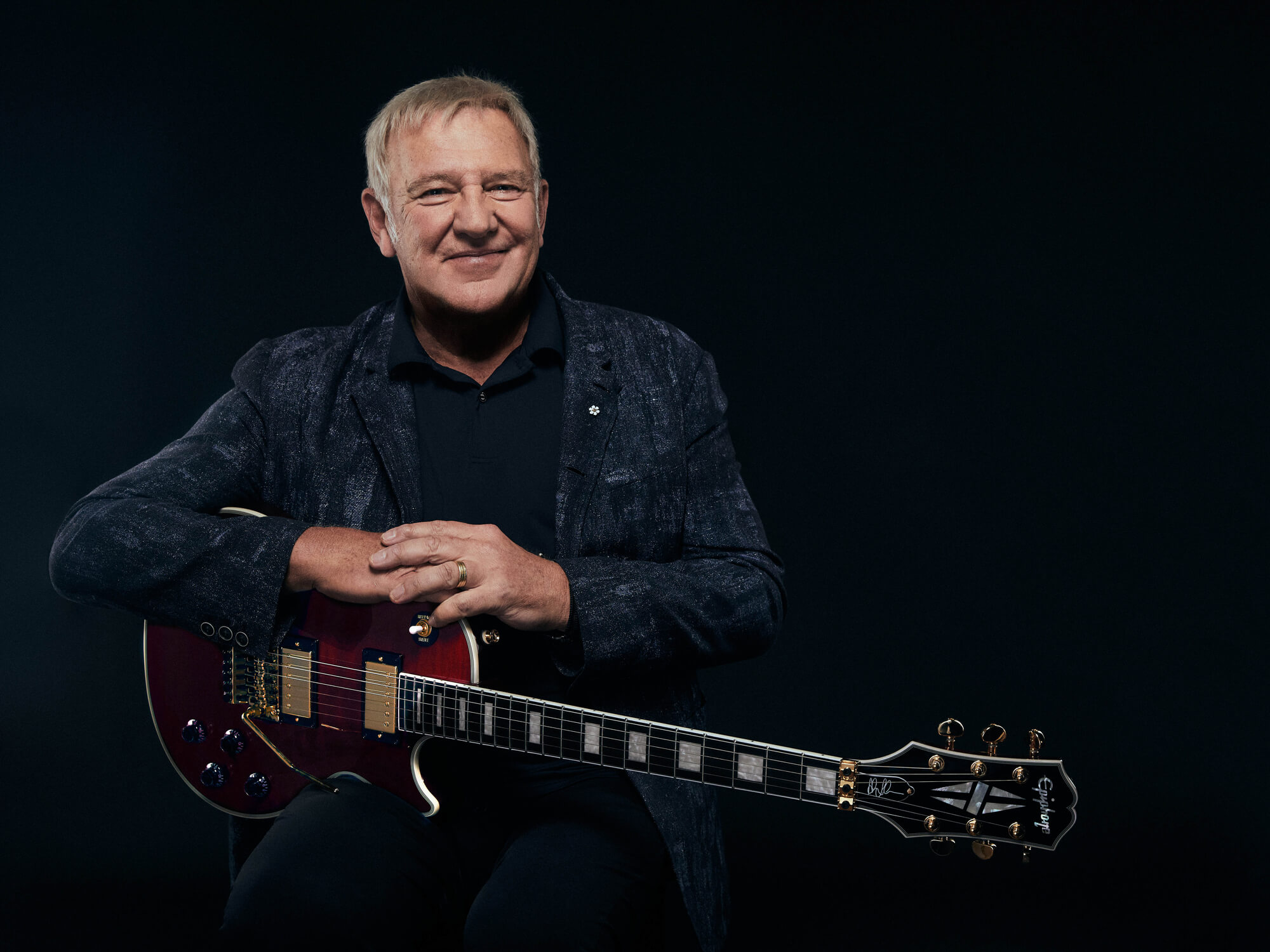 Alex Lifeson with his Epiphone Les Paul Custom Axcess in Ruby