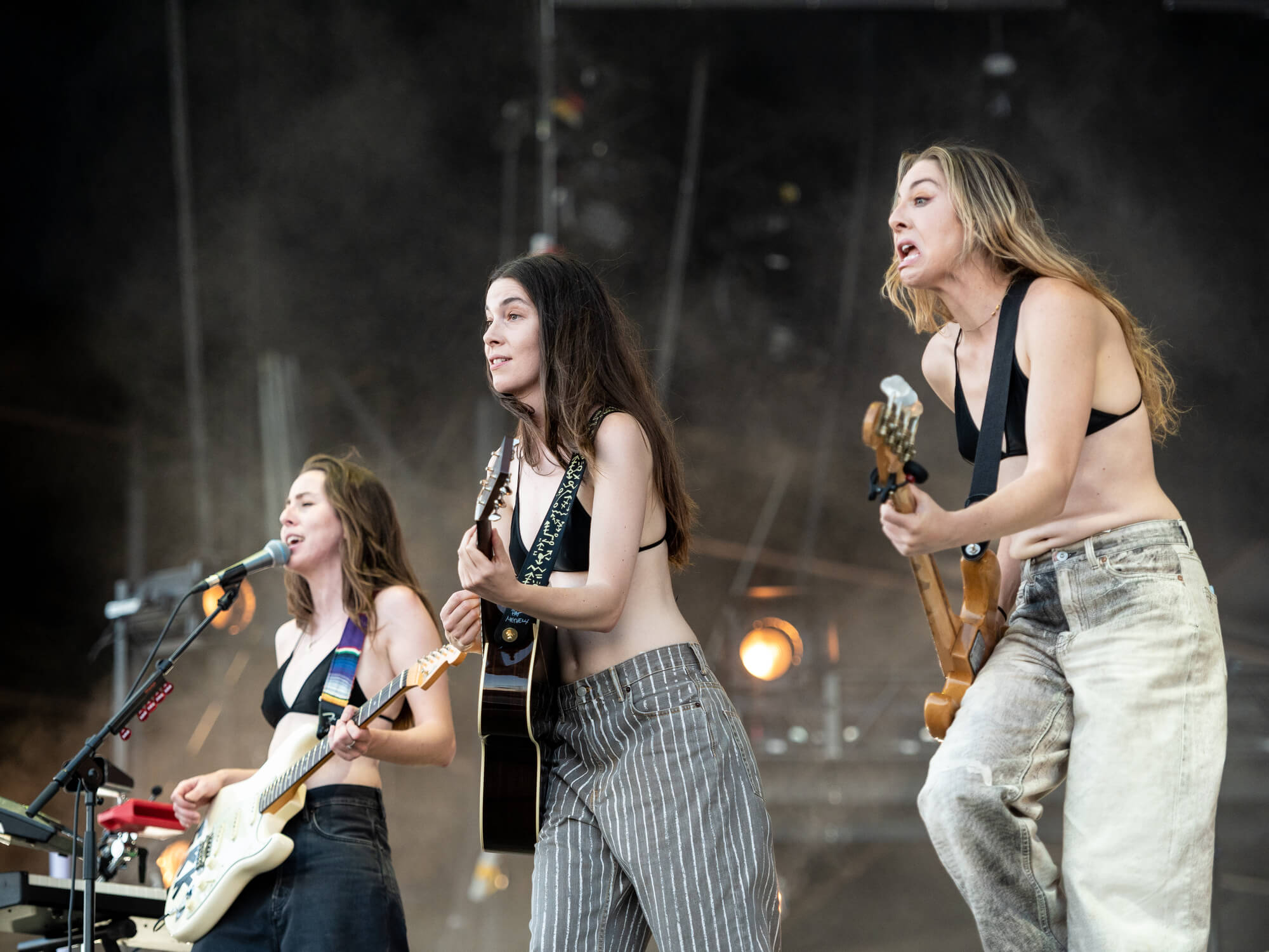 Haim playing instruments on stage