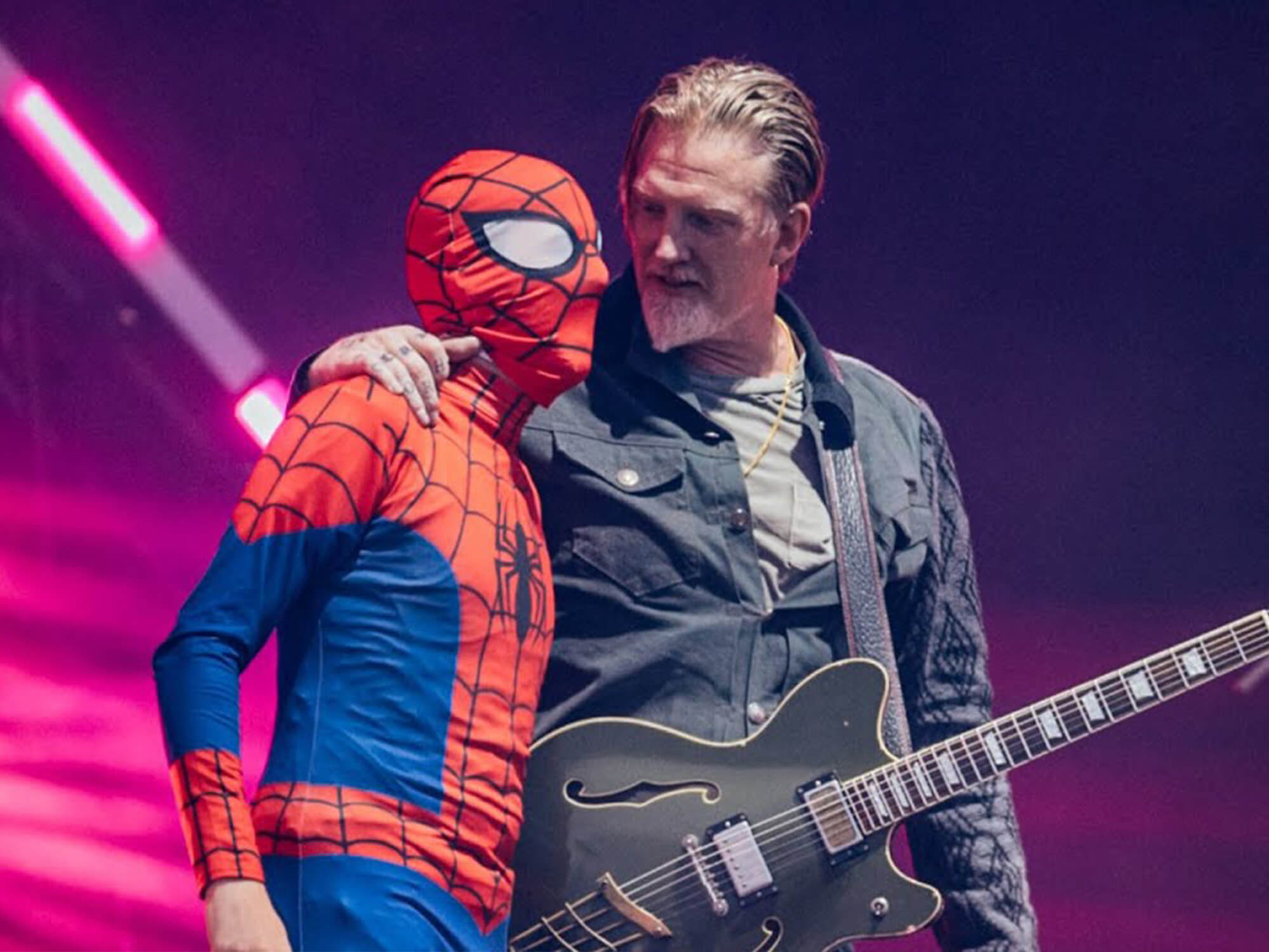 Josh Homme onstage with Spider-Man