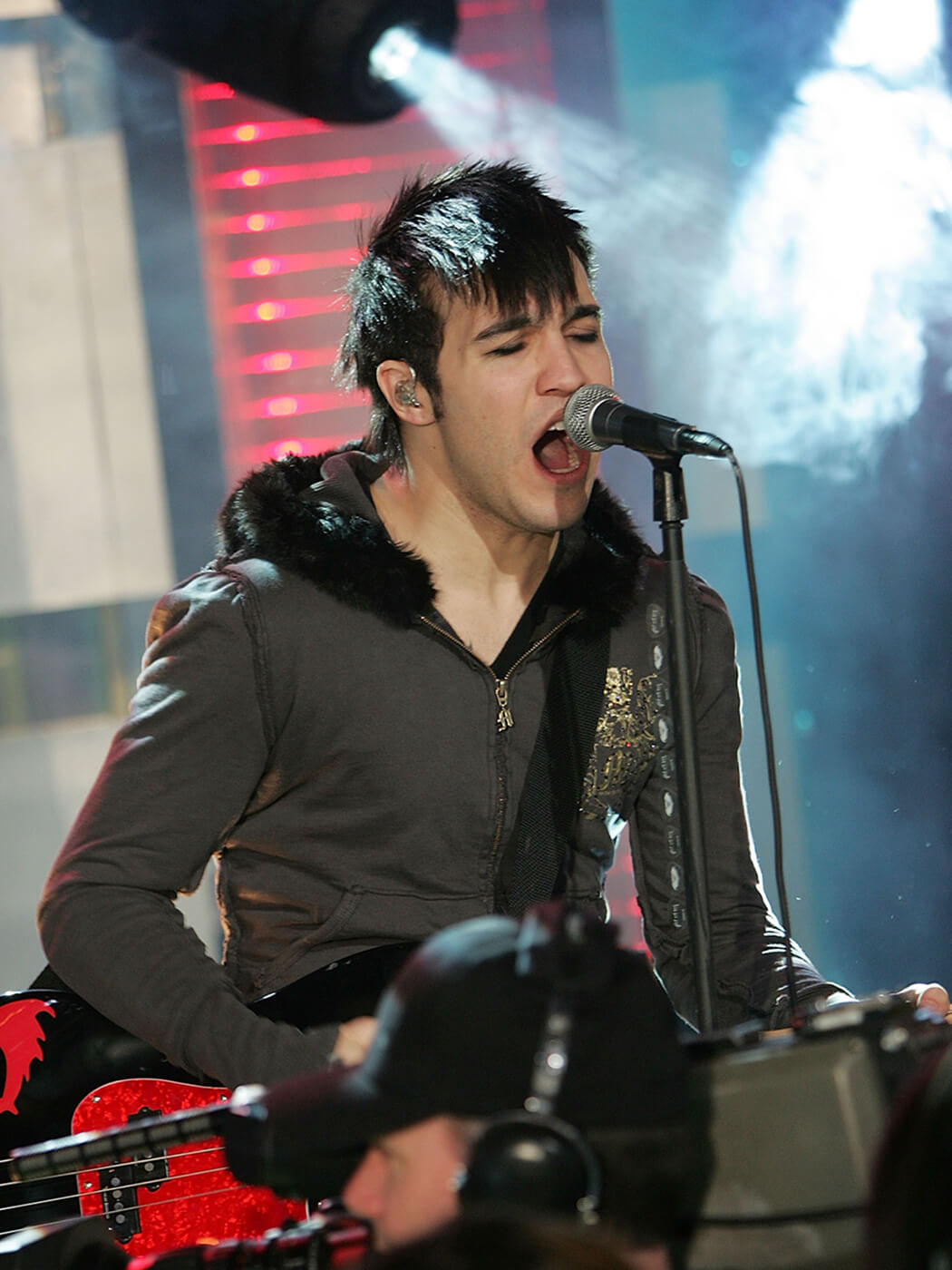 Pete Wentz of Fall Out Boy performing at MTV’s Total Request Live as part of “Infinity Flight 206 With Fall Out Boy” in 2007, by Scott Gries/Getty Images