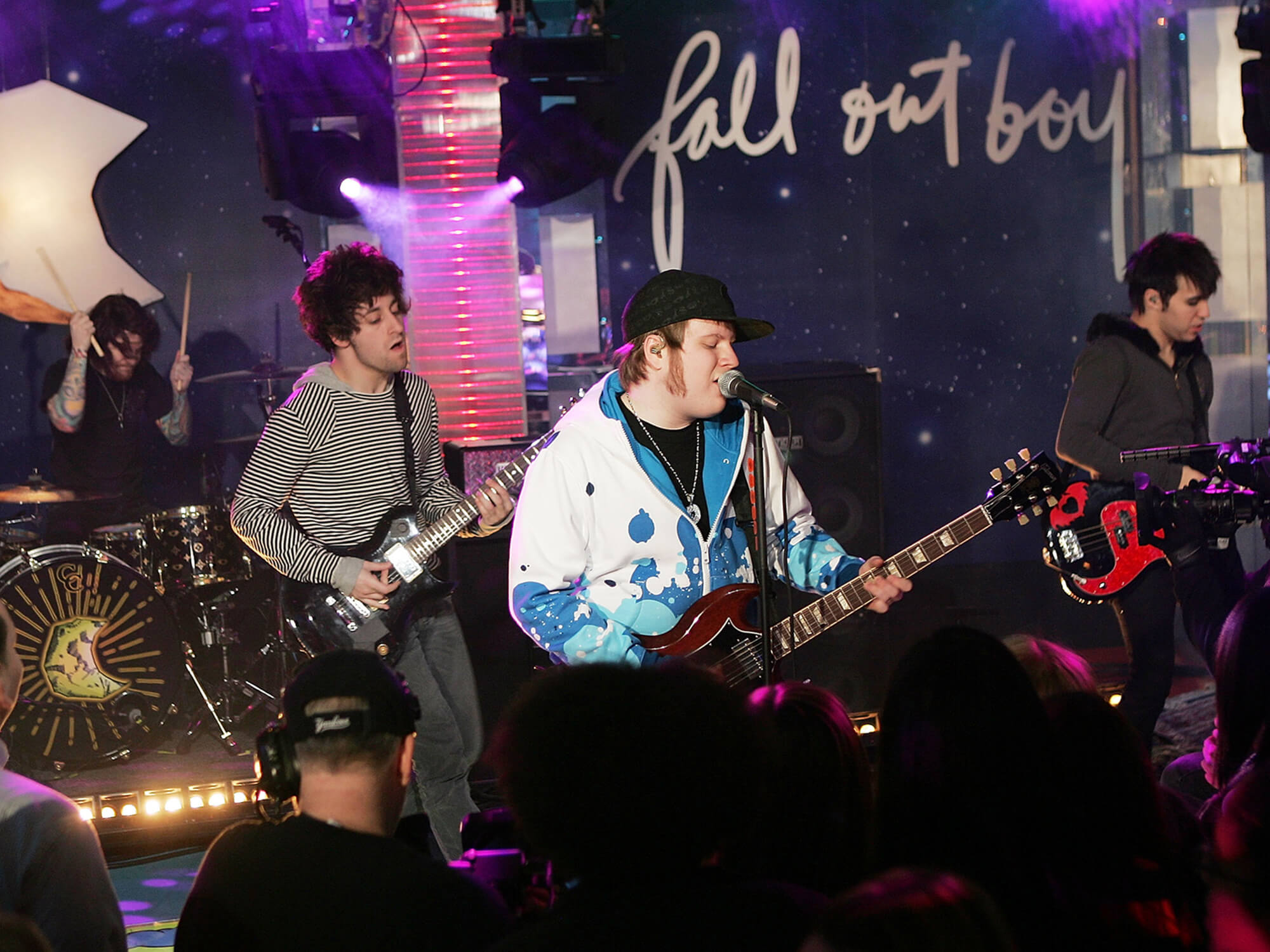 Fall Out Boy performing at MTV’s Total Request Live as part of “Infinity Flight 206 With Fall Out Boy” in 2007, by Scott Gries/Getty Images