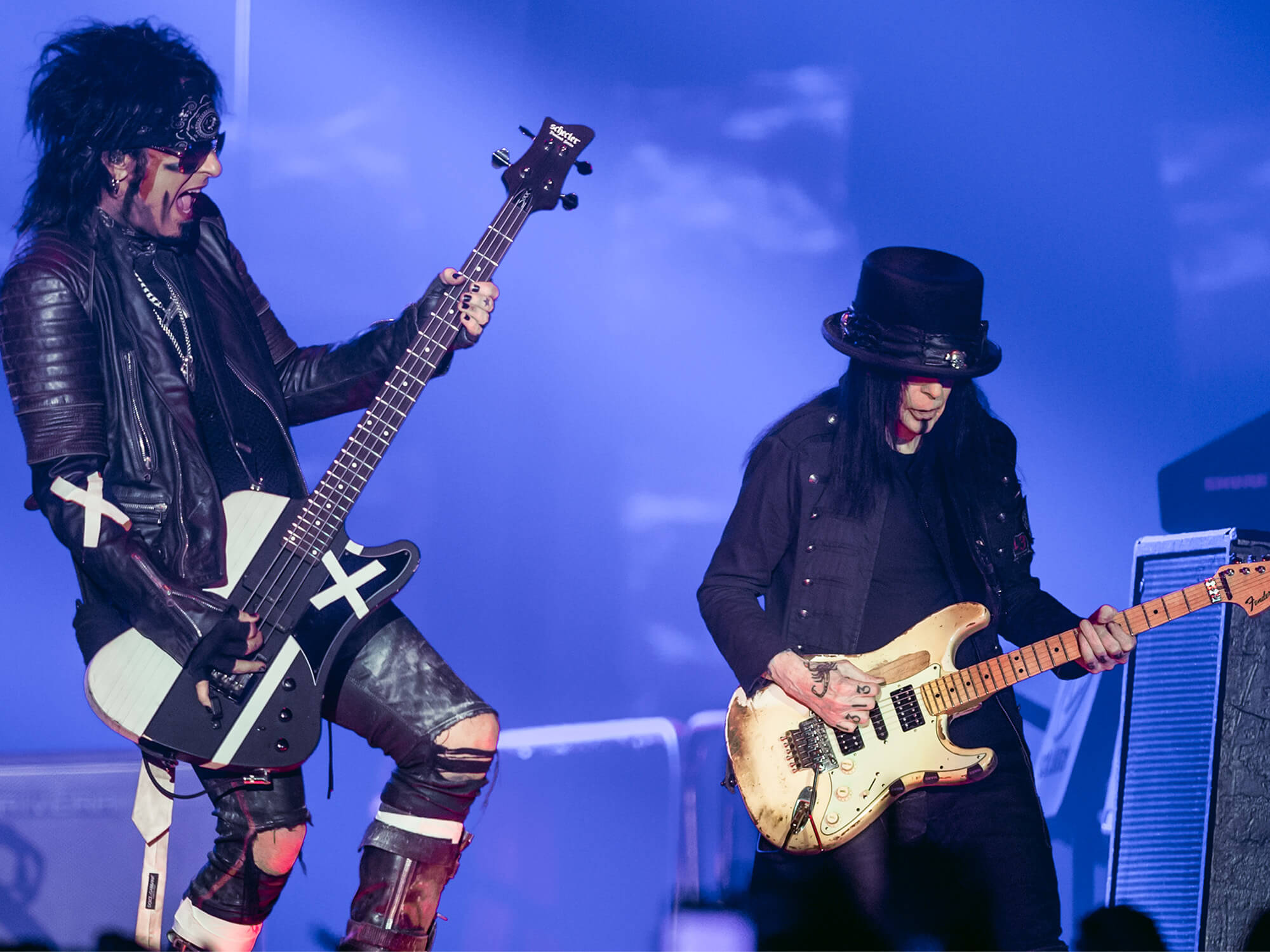 Nikki Sixx and Mick Mars on stage in 2015