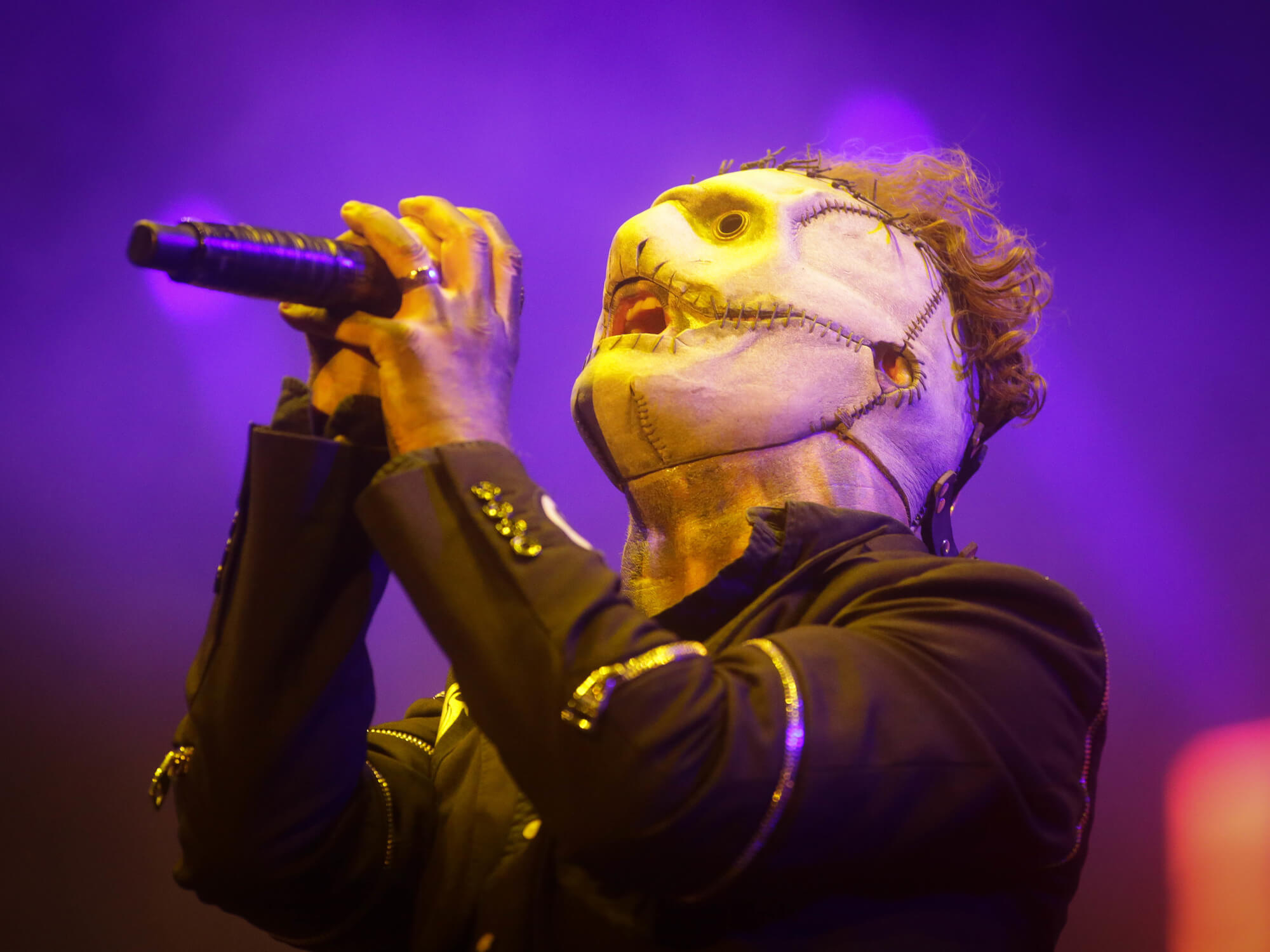 Corey Taylor of Slipknot performing live wearing a mask