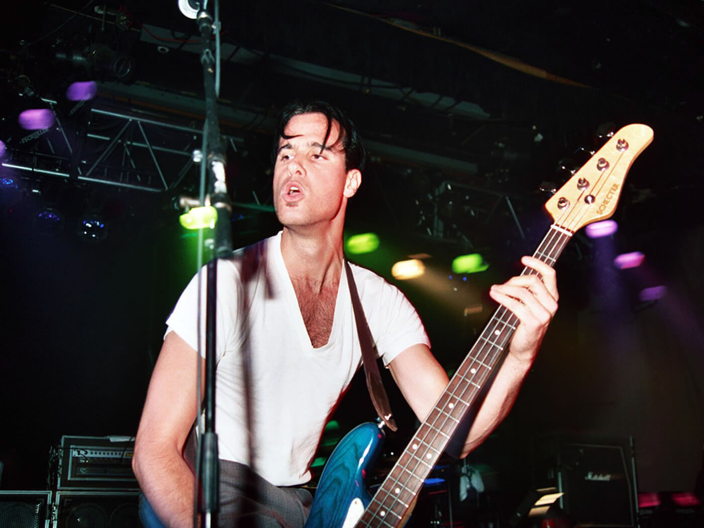 Robert DeLeo of Stone Temple Pilots playing his Schecter bass in 1993 by Jeff Kravitz/FilmMagic, Inc via Getty Images