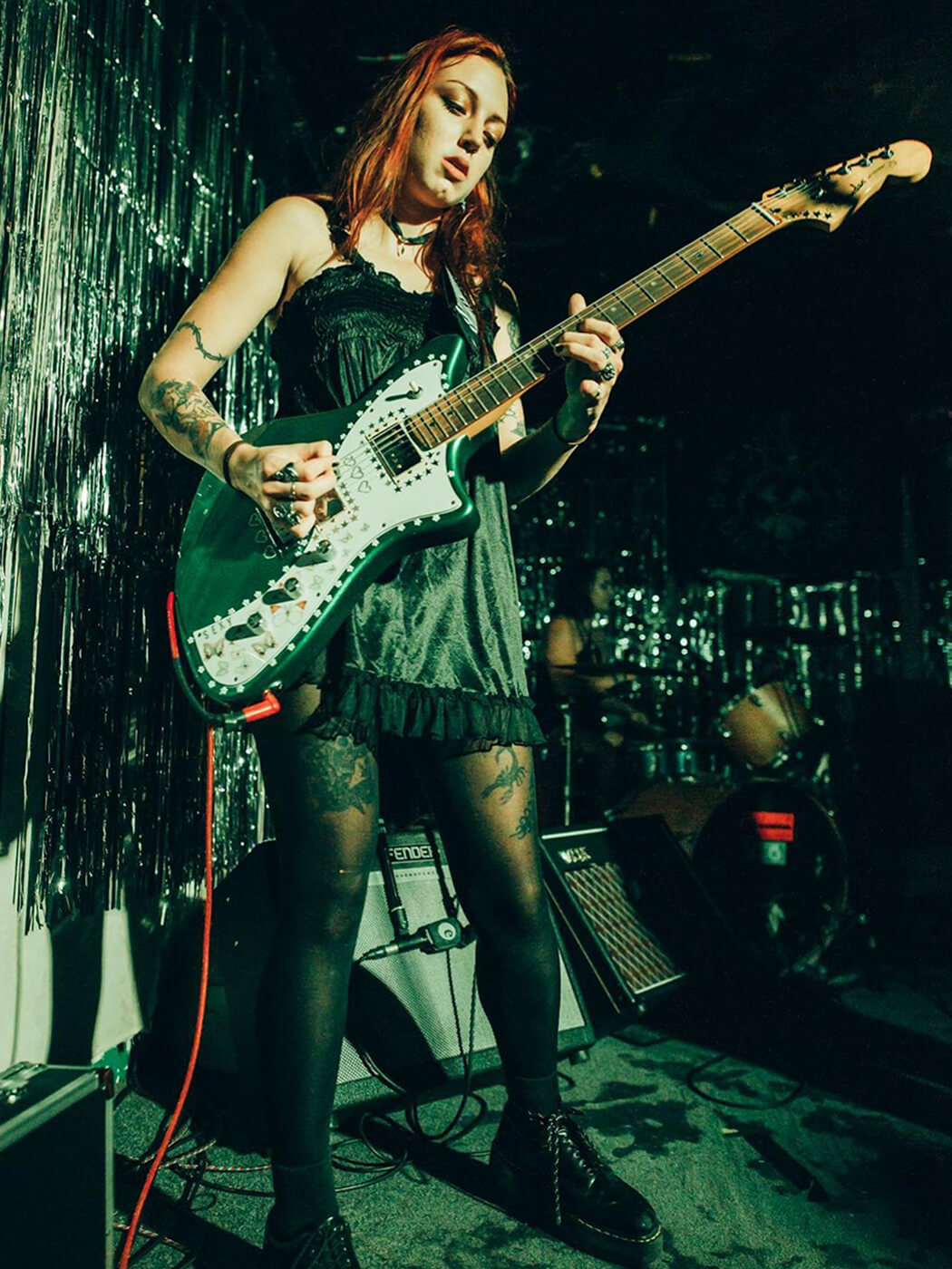 Scarlett McKahey playing her Fender Meteora, from Teen Jesus and the Jean Teasers Official Facebook