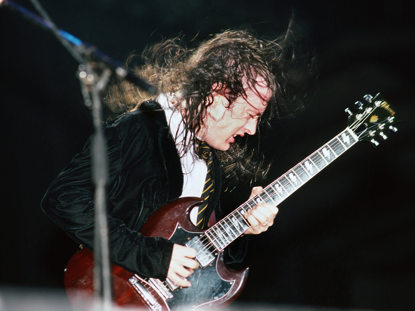 Angus Young of AC/DC shredding on a Gibson SG with lightning inlays by Michael Ochs Archives/Getty Images