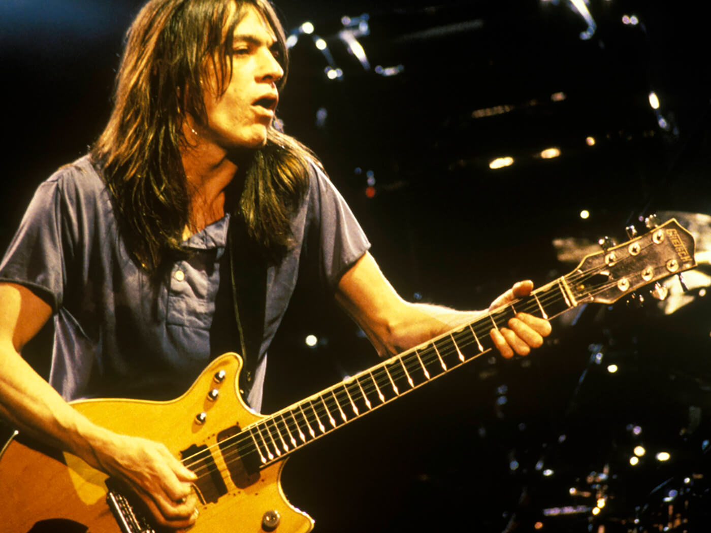 Malcolm Young of AC/DC performing with his Gretsch 6131 Jet Firebird by Bob King/Redferns via Getty Images