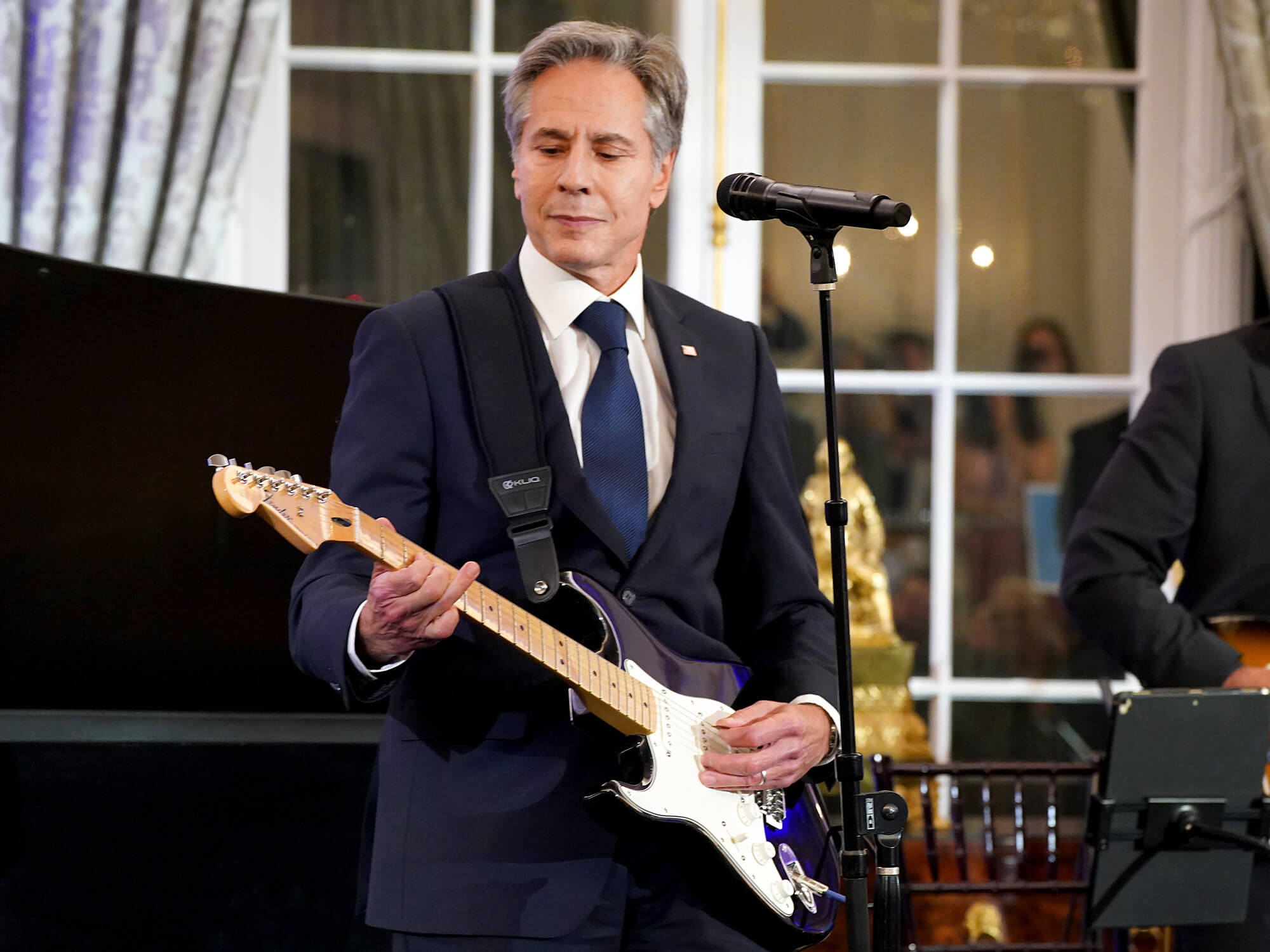 U.S. Secretary of State Antony Blinken performs onstage during the launch of the Global Music Diplomacy Initiative