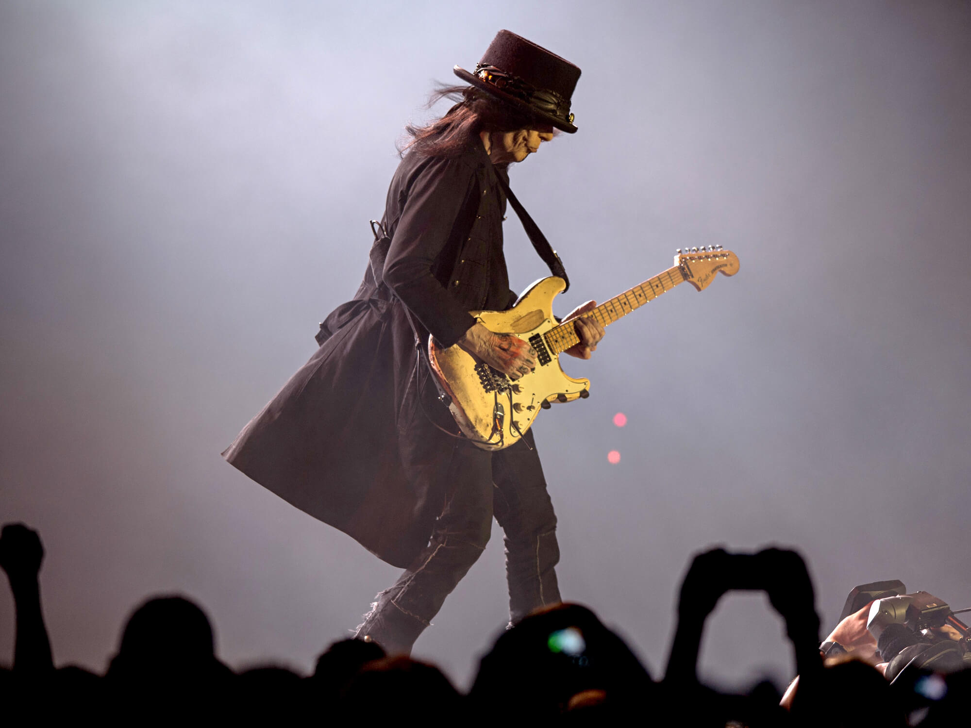 Mick Mars of the band Motley Crue performs
