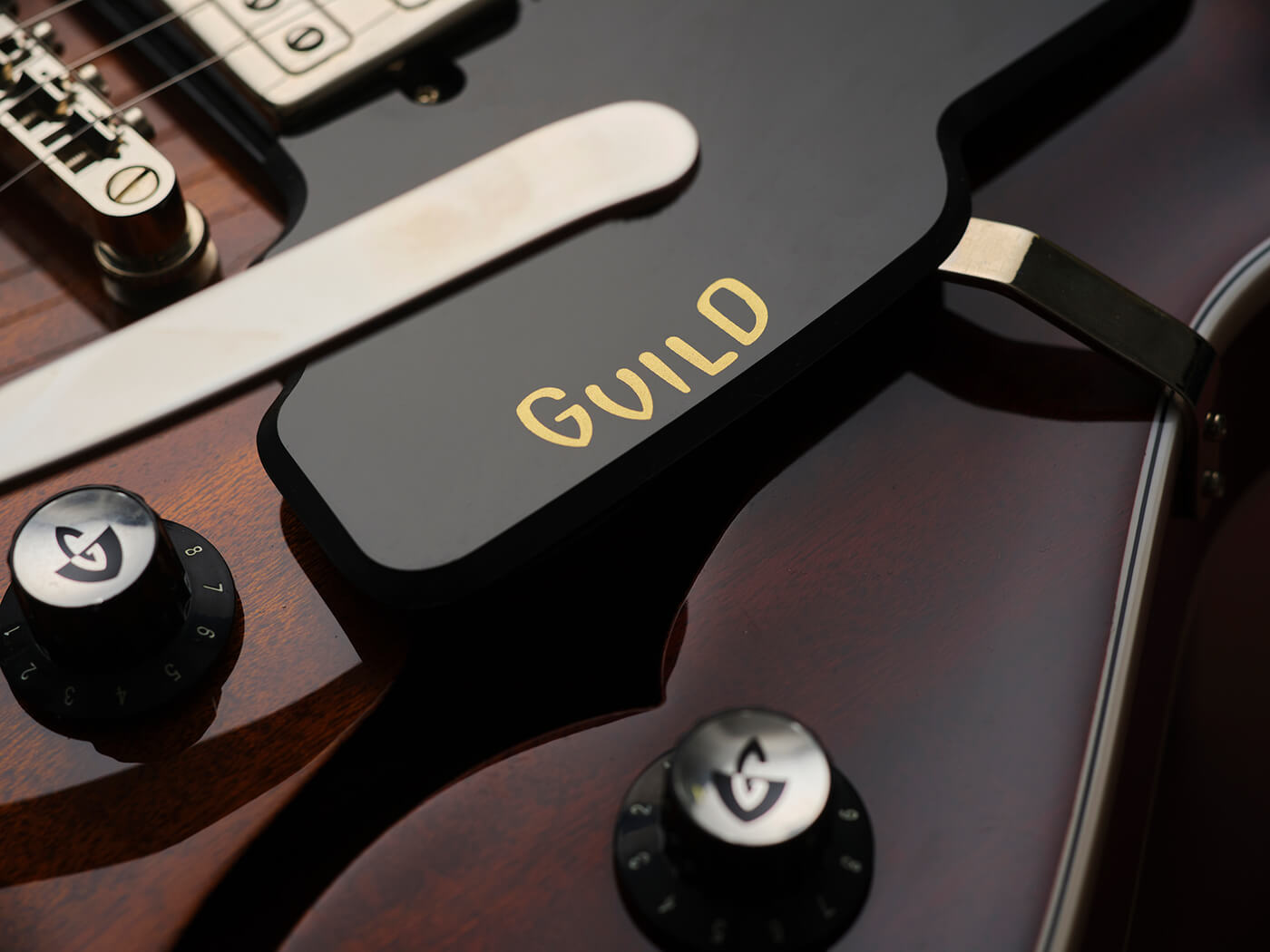 Guild Starfire pickguard with logo, photo by Adam Gasson