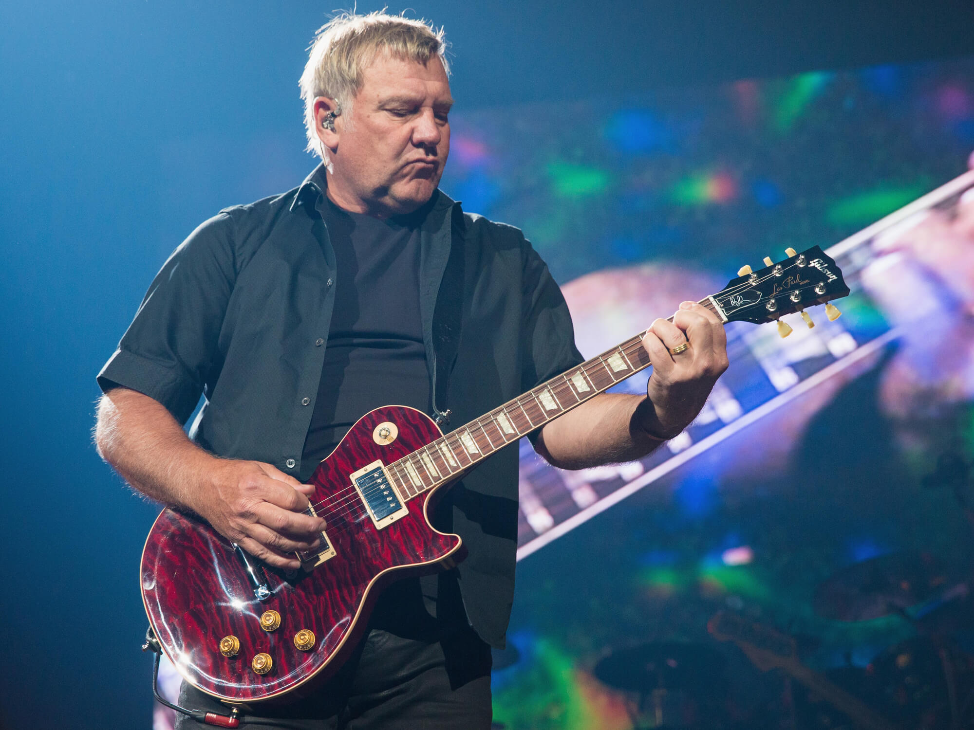 Alex Lifeson of Rush performs on stage