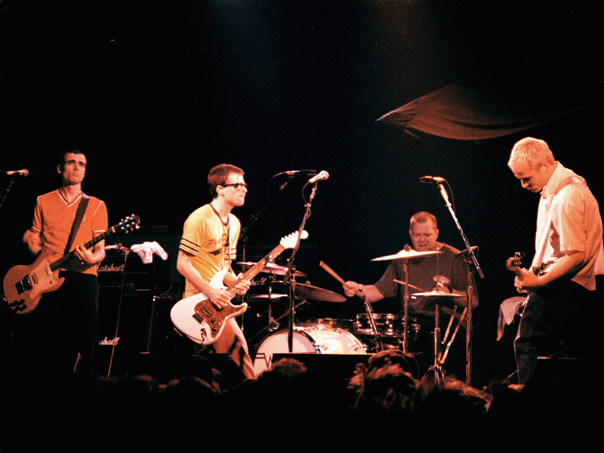 Weezer performing in 1995, photo by Jim Steinfeldt/Michael Ochs Archives via Getty Images