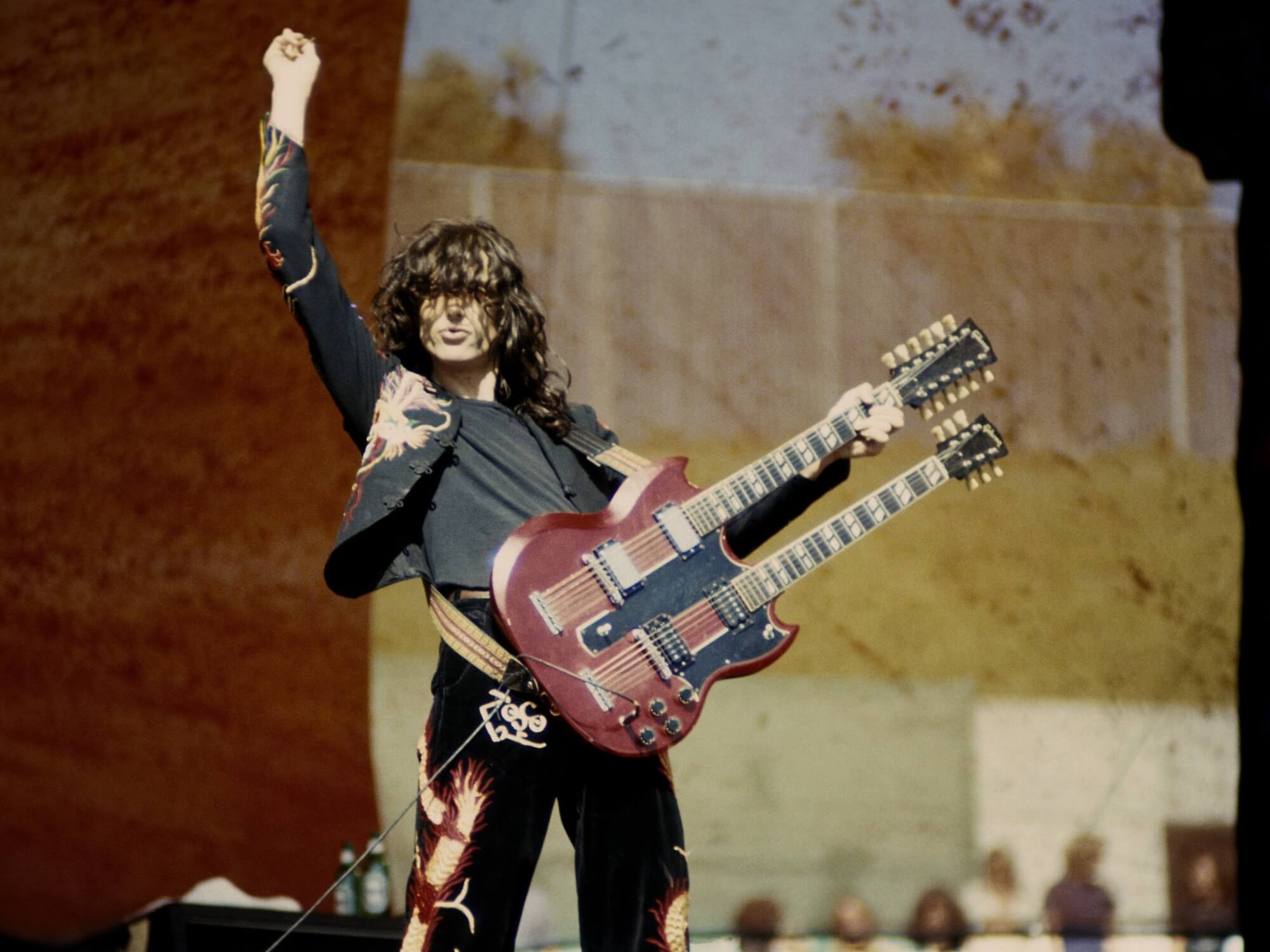 Jimmy Page performing with Led Zeppelin