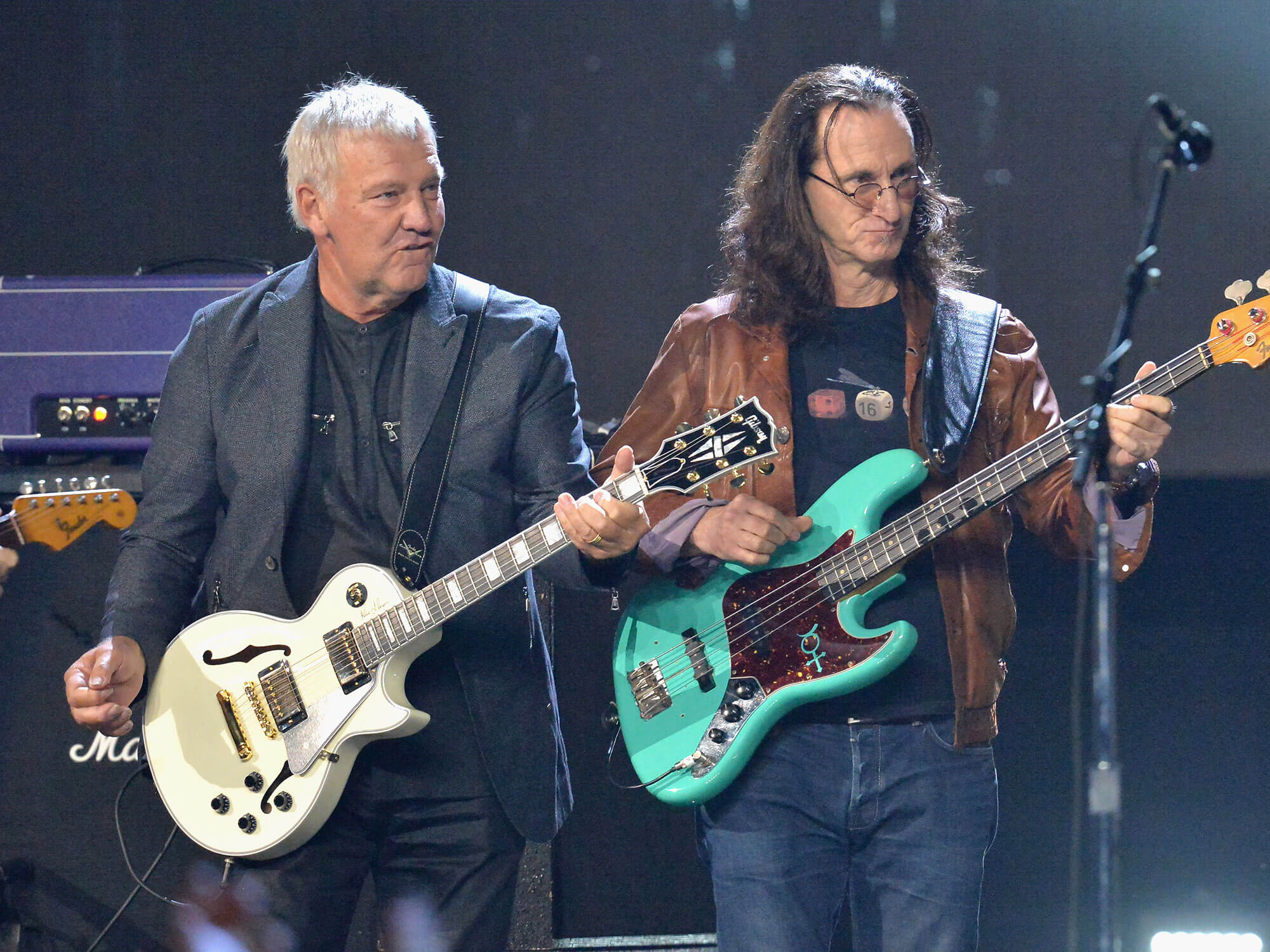 [L-R] Alex Lifeson and Geddy Lee performing live