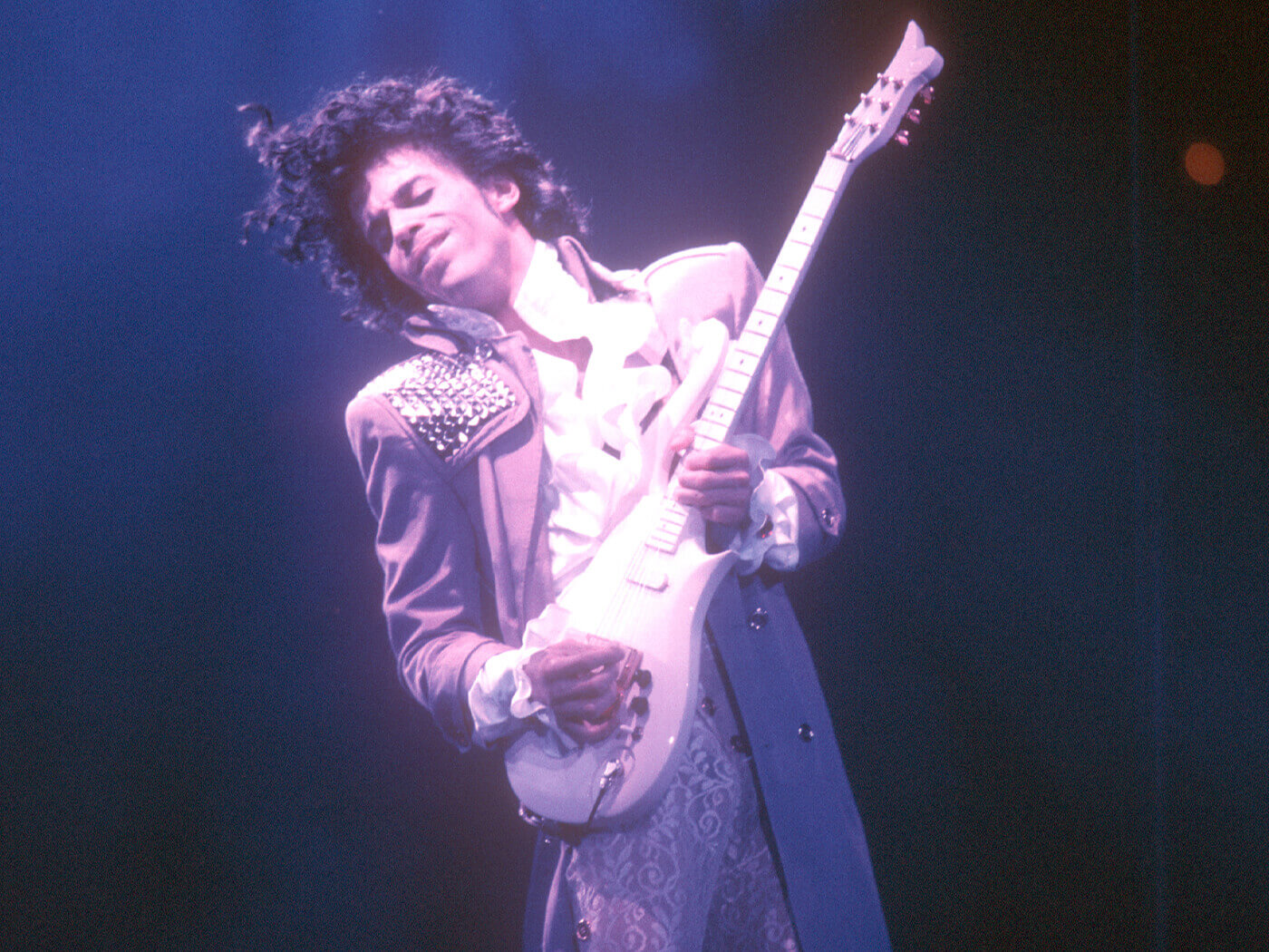 Prince performing onstage in the ’80s, photo by Michael Ochs Archives/Getty Images