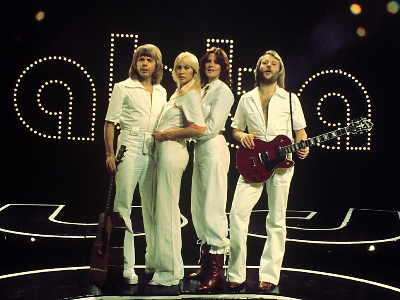 ABBA photographed in 1974, Benny Andersson holds a Hagstrom Swede guitar, photo by Peter Bischoff/Getty Images