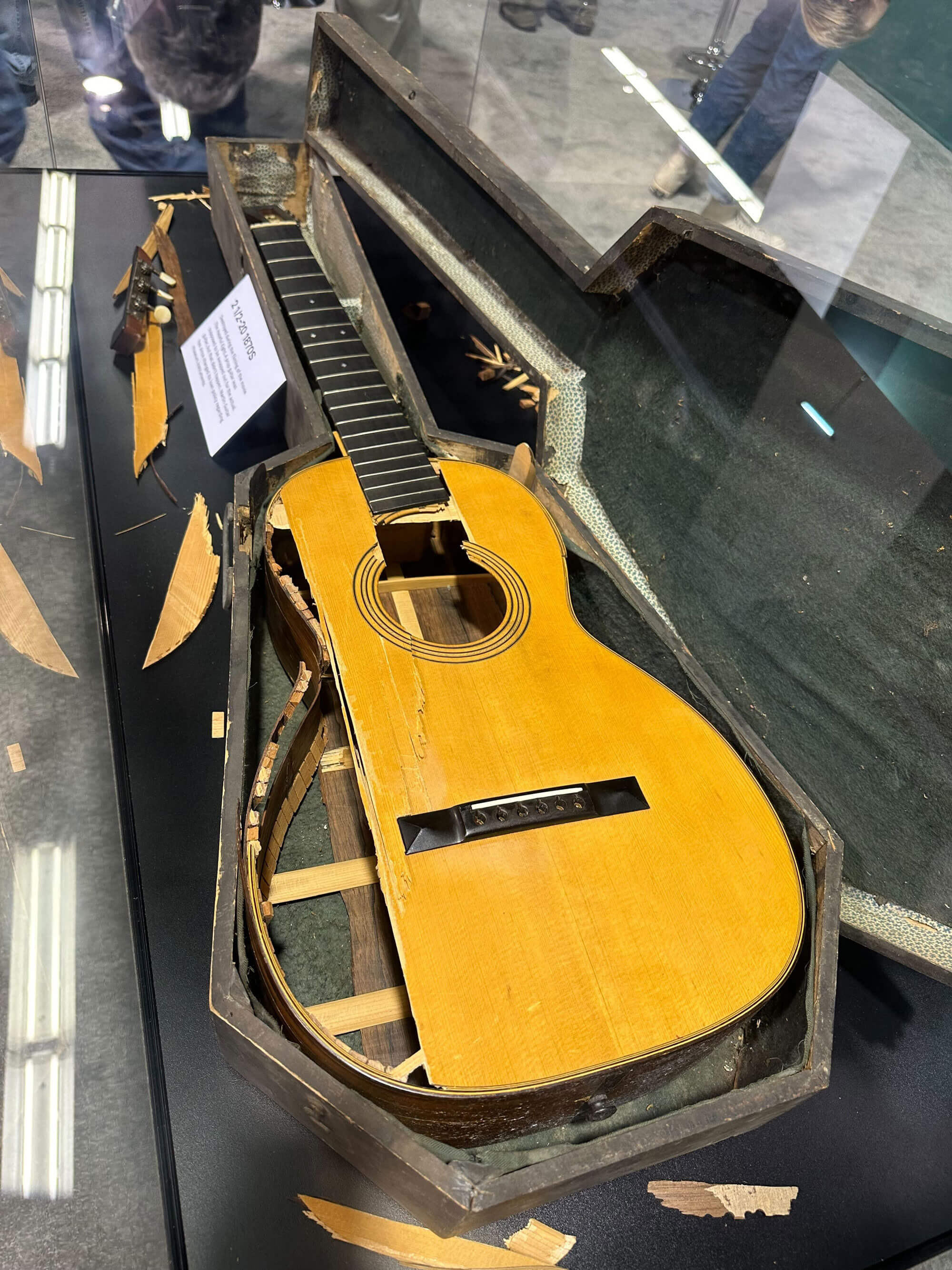 1870 Martin smashed on the set of The Hateful Eight on display at NAMM 2024