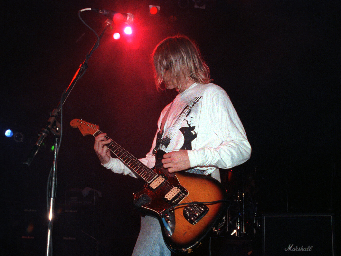 Kurt Cobain playing a Fender Jaguar onstage in 1991, photo by Ian Dickson/Redferns via Getty Images