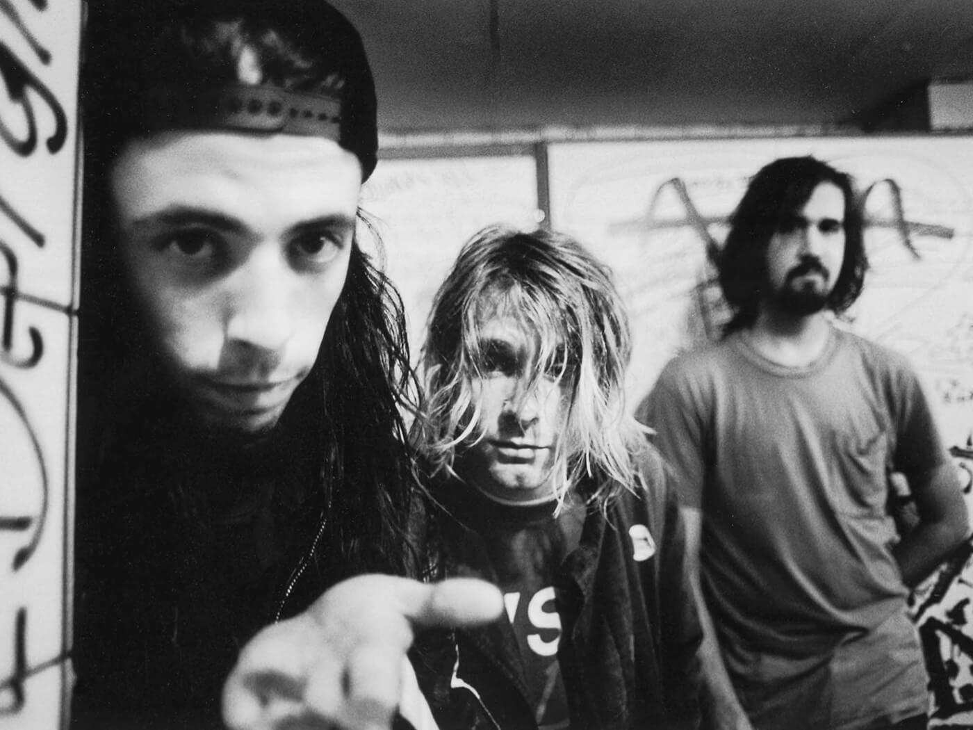 Black and white photo of Nirvana in 1991, by Paul Bergen/Redferns via Getty Images