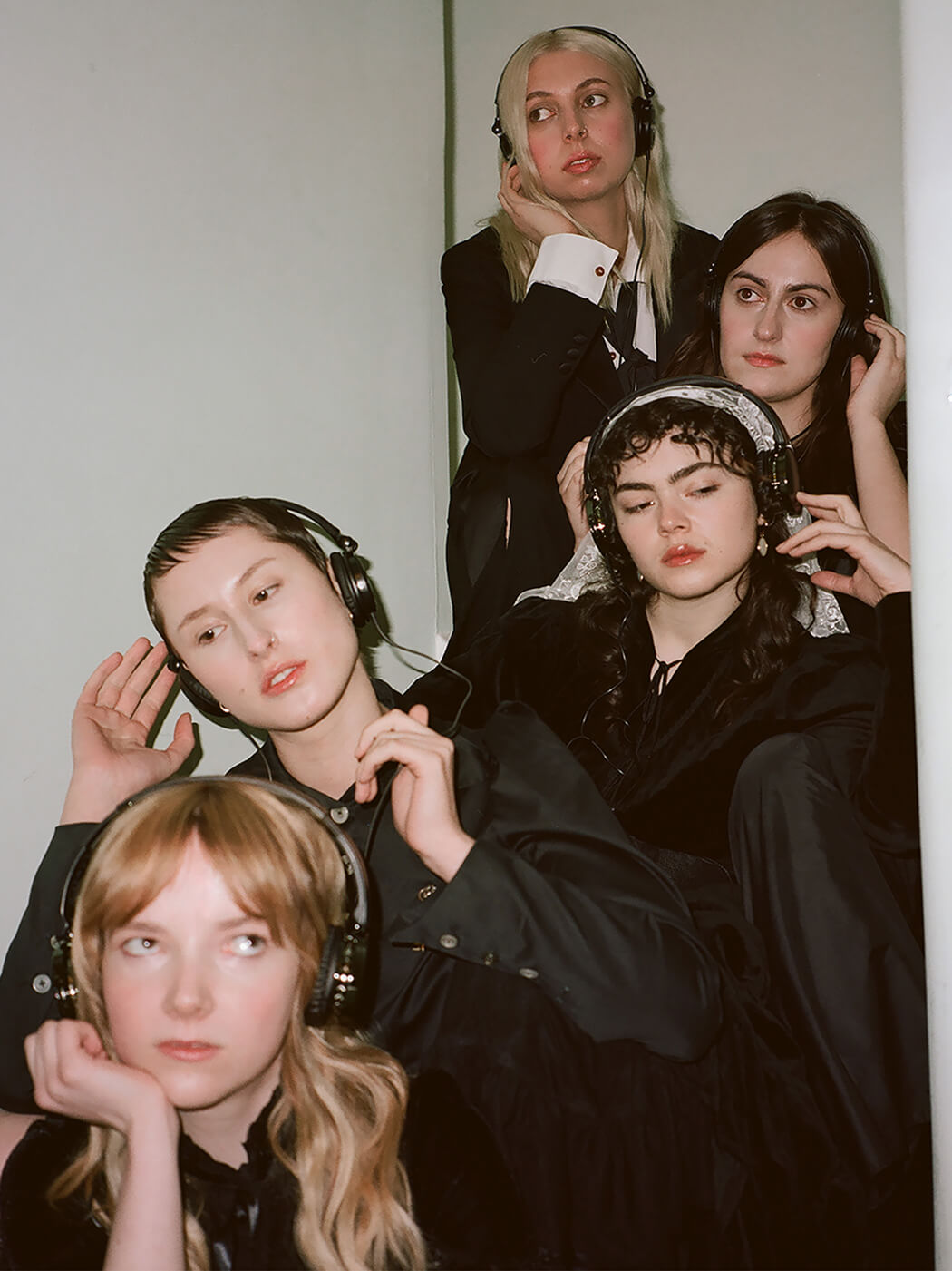 The Last Dinner Party photographed wearing headphones