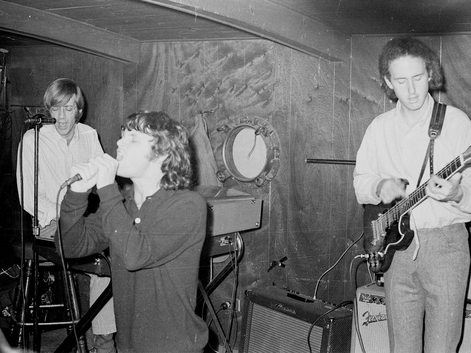 Black and white photo of The Doors performing in 1966. Robby can be seen on the right playing his SG.