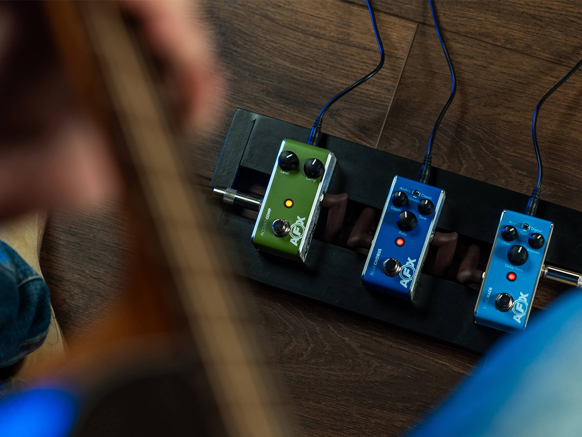 A photo of the Fishman AFX Mini pedals on a pedal board taken from above.