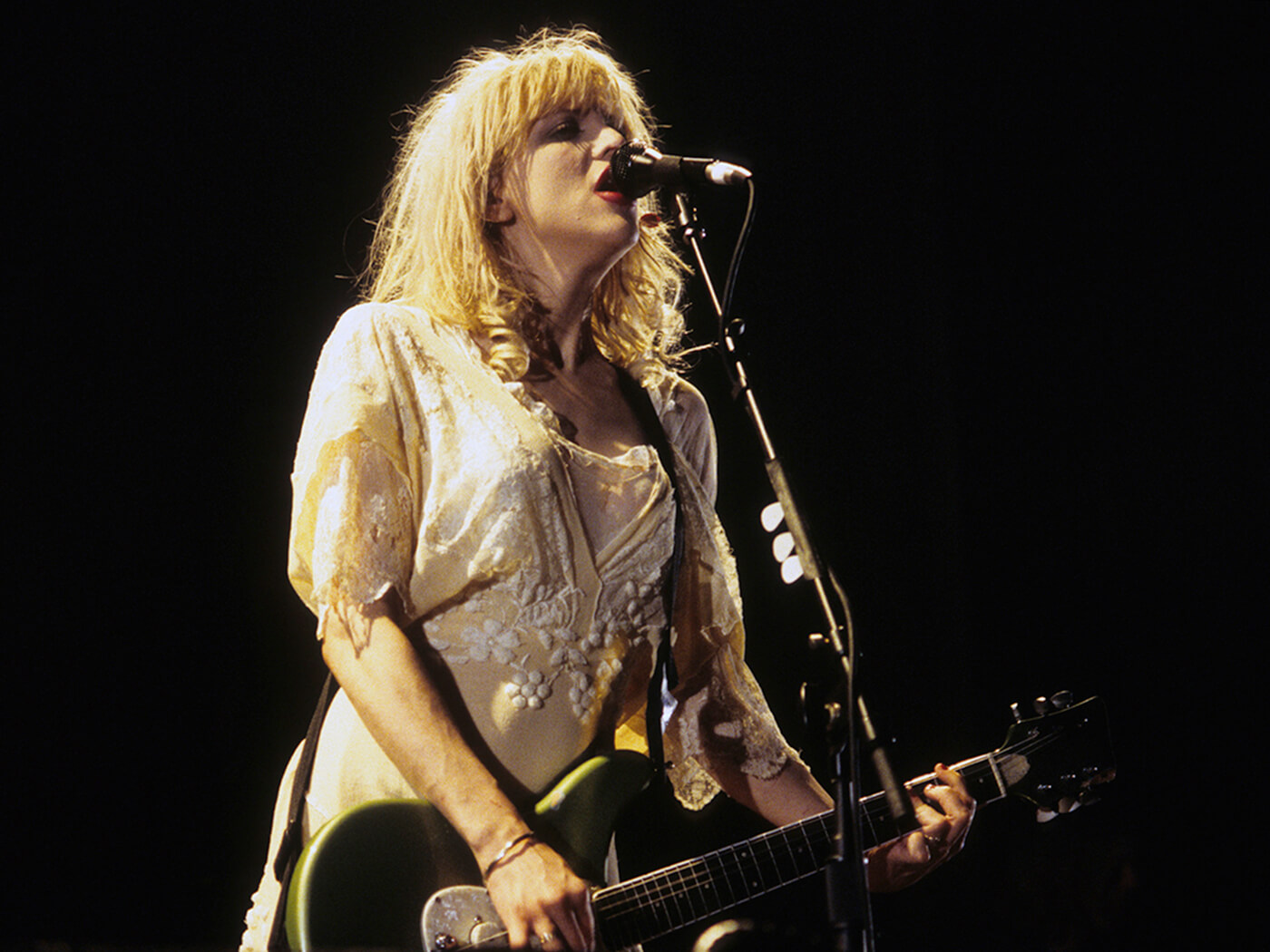 Courtney Love performing with Hole in 1994, photo by Jim Steinfeldt/Michael Ochs Archives via Getty Images