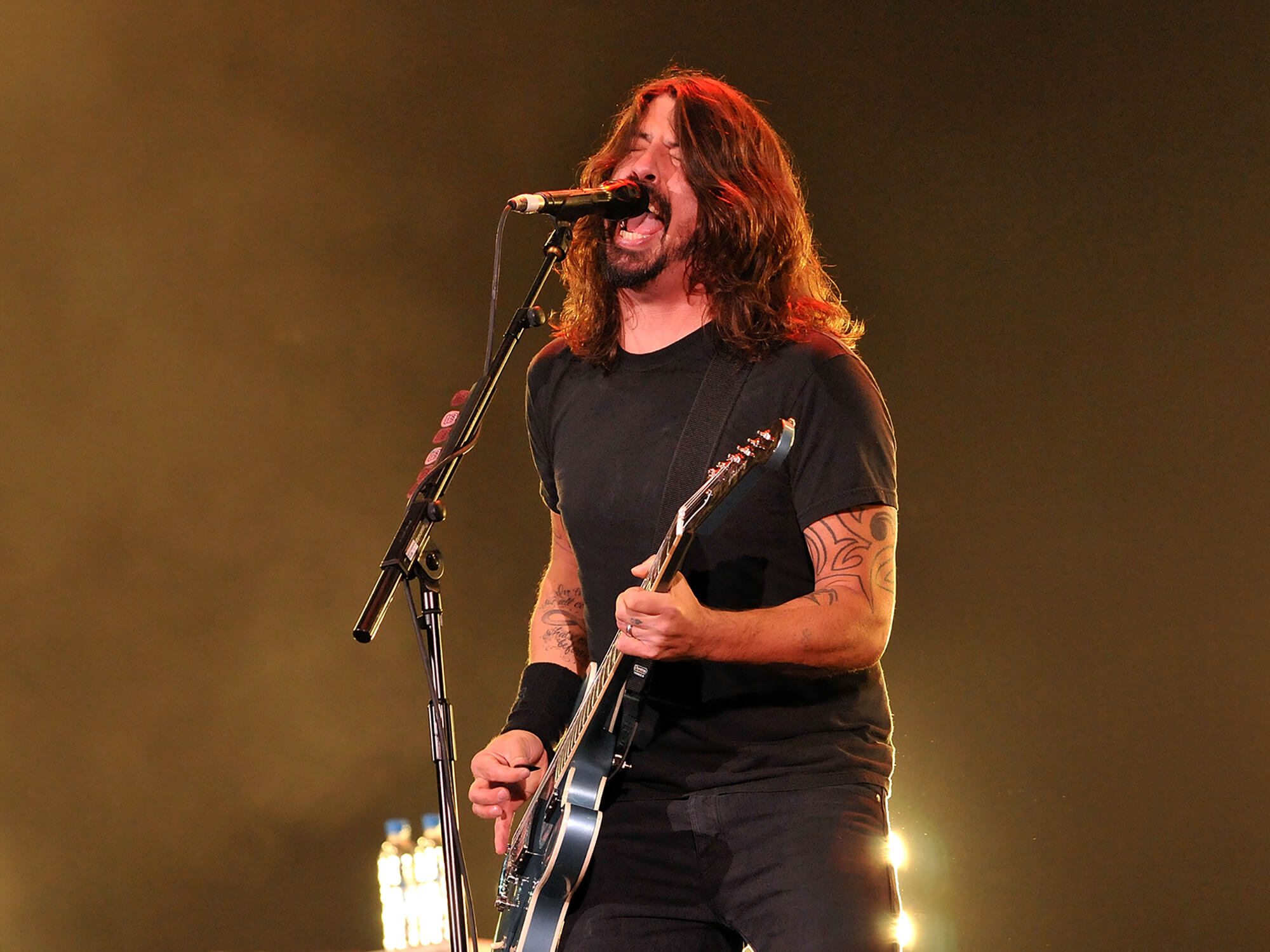 Dave Grohl performing in 2014, photo by Jim Dyson/Redferns via Getty Images