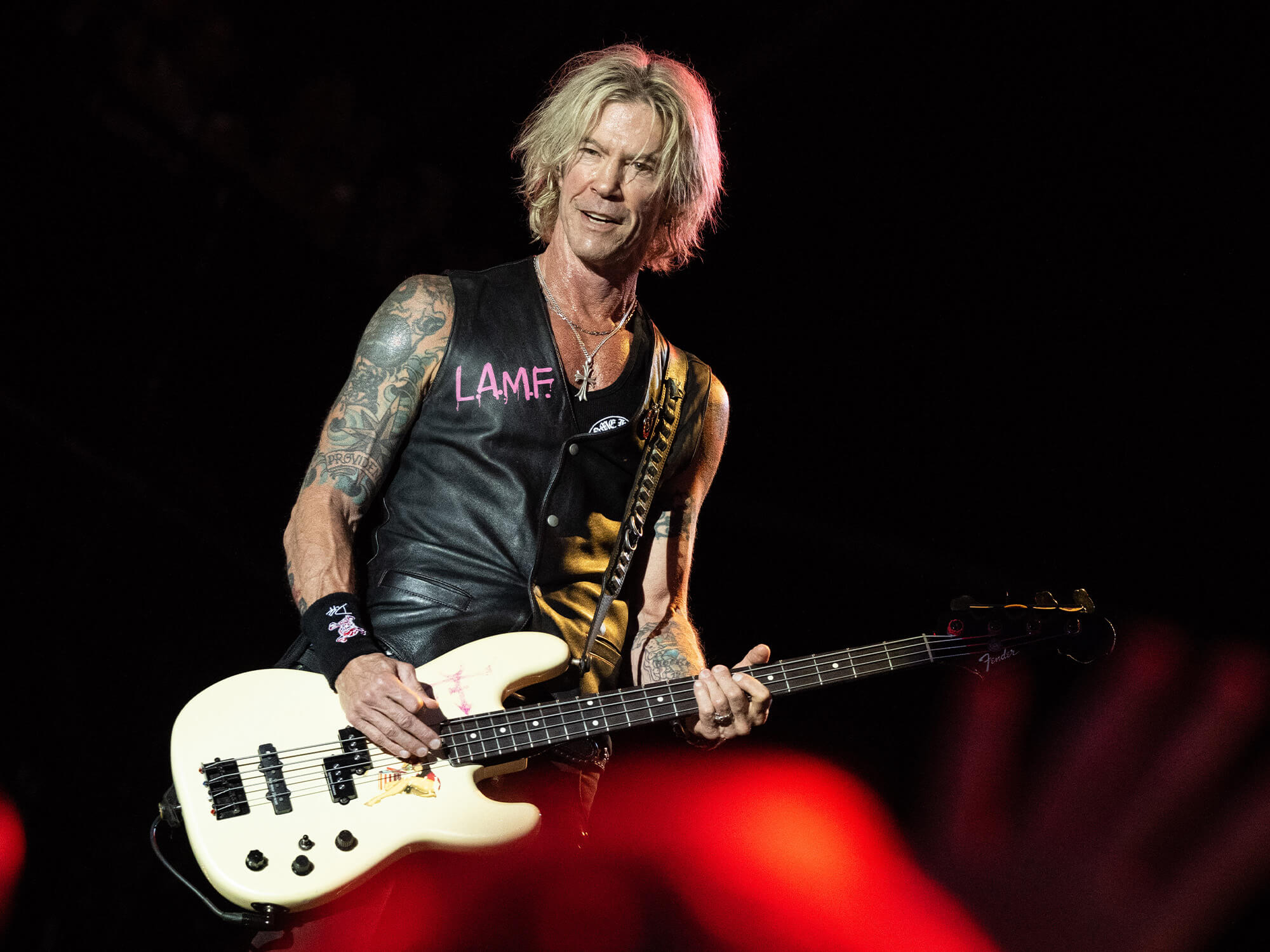 Duff McKagan with his bass guitar on stage at Glastonbury.