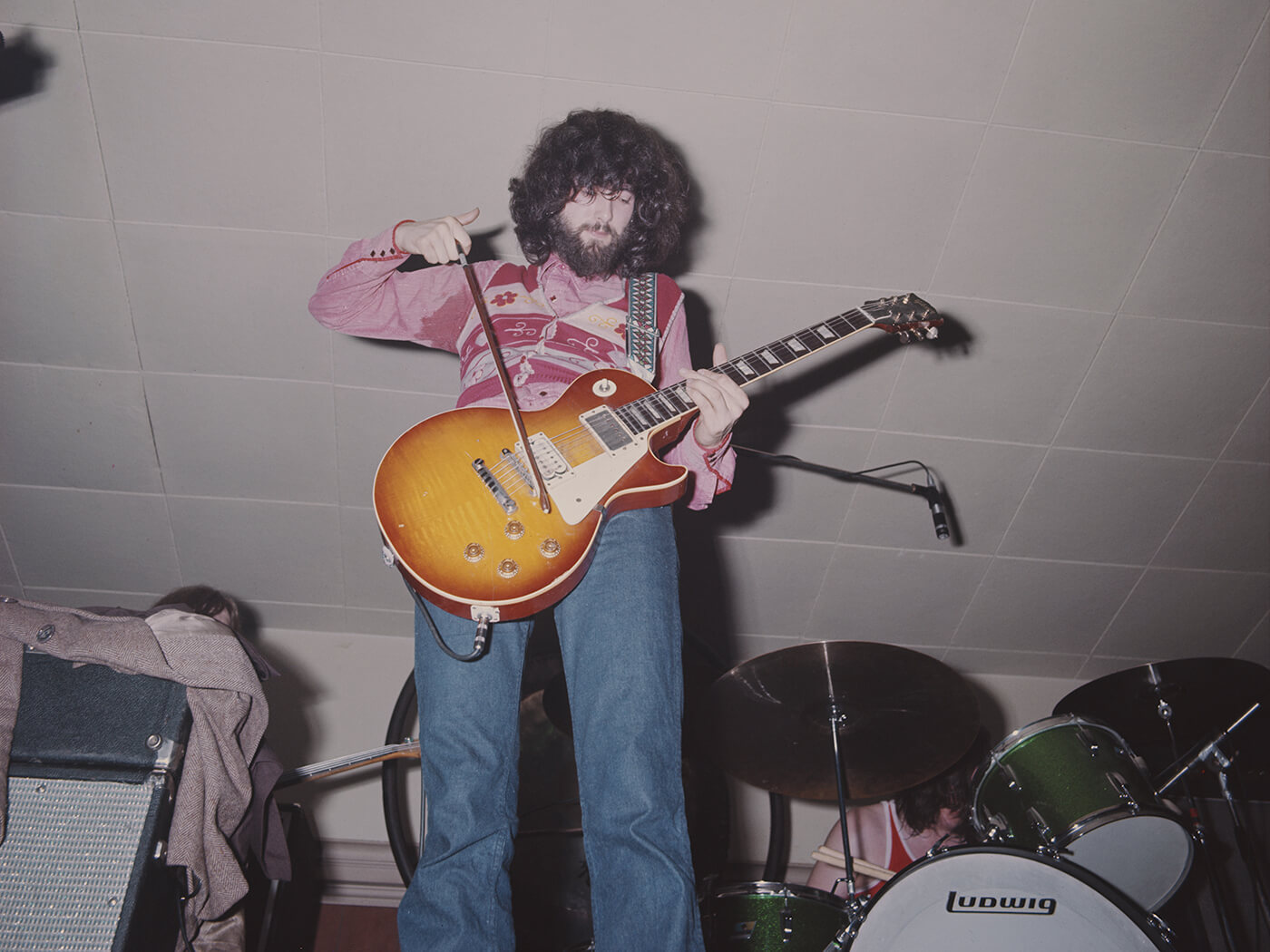 Jimmy Page playing a Gibson Les Paul with a violin bow in 1969, photo by Michael Putland/Getty Images