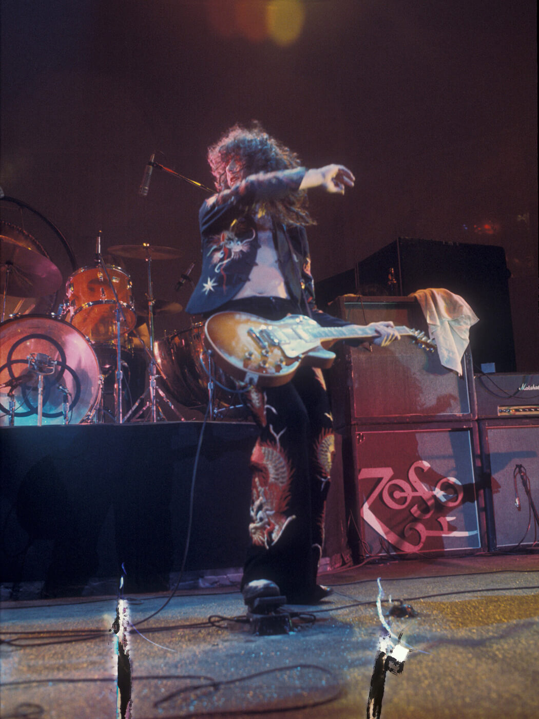Jimmy Page performing in 1975 with a wah pedal, photo by Watal Asanuma/Shinko Music via Getty Images