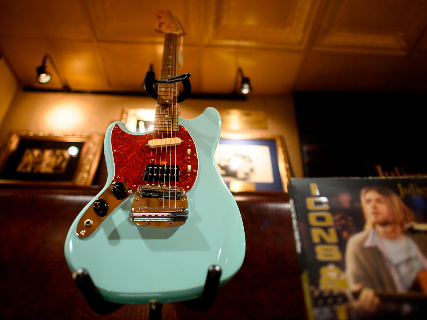 Kurt Cobain’s custom-built left-handed Fender Mustang on display at Hard Rock Cafe in New York City in 2019, photo by Johannes Eisele/AFP via Getty Images