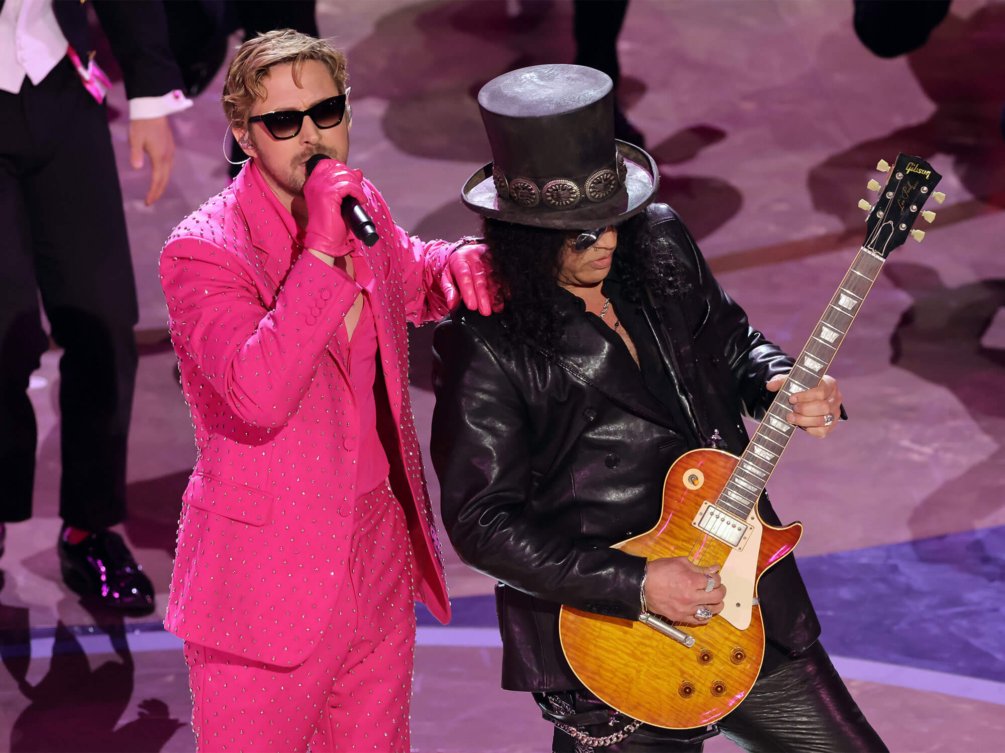 [L-R] Ryan Gosling and Slash perform onstage at the Oscars 2024