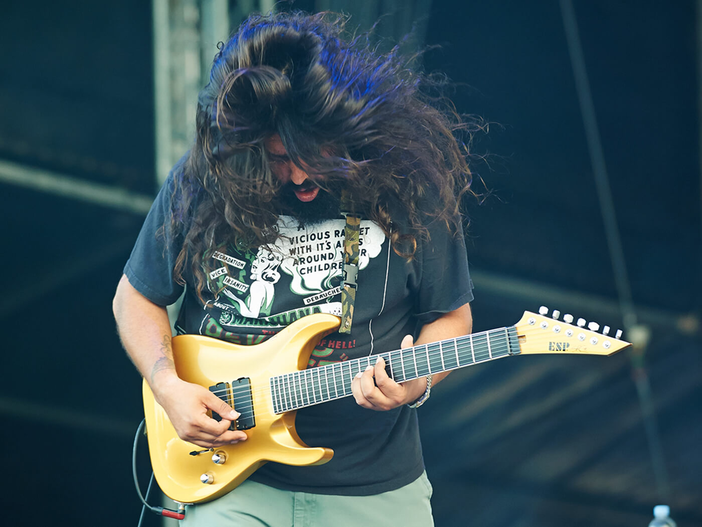 Stephen Carpenter of Deftones performing with an ESP guitar in 2014, photo by Gary Wolstenholme/Redferns via Getty Images