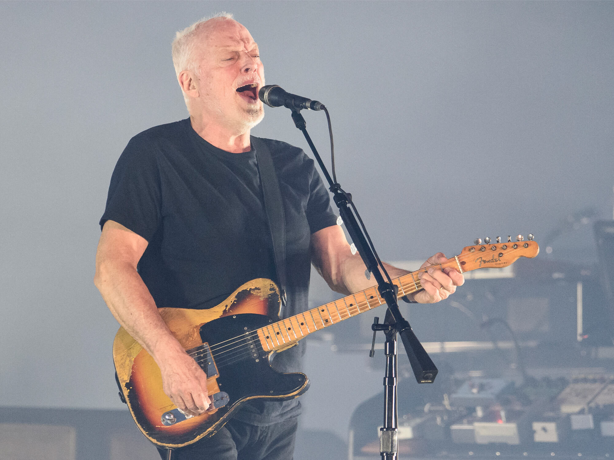 David Gilmour playing a Telecaster on stage and singing