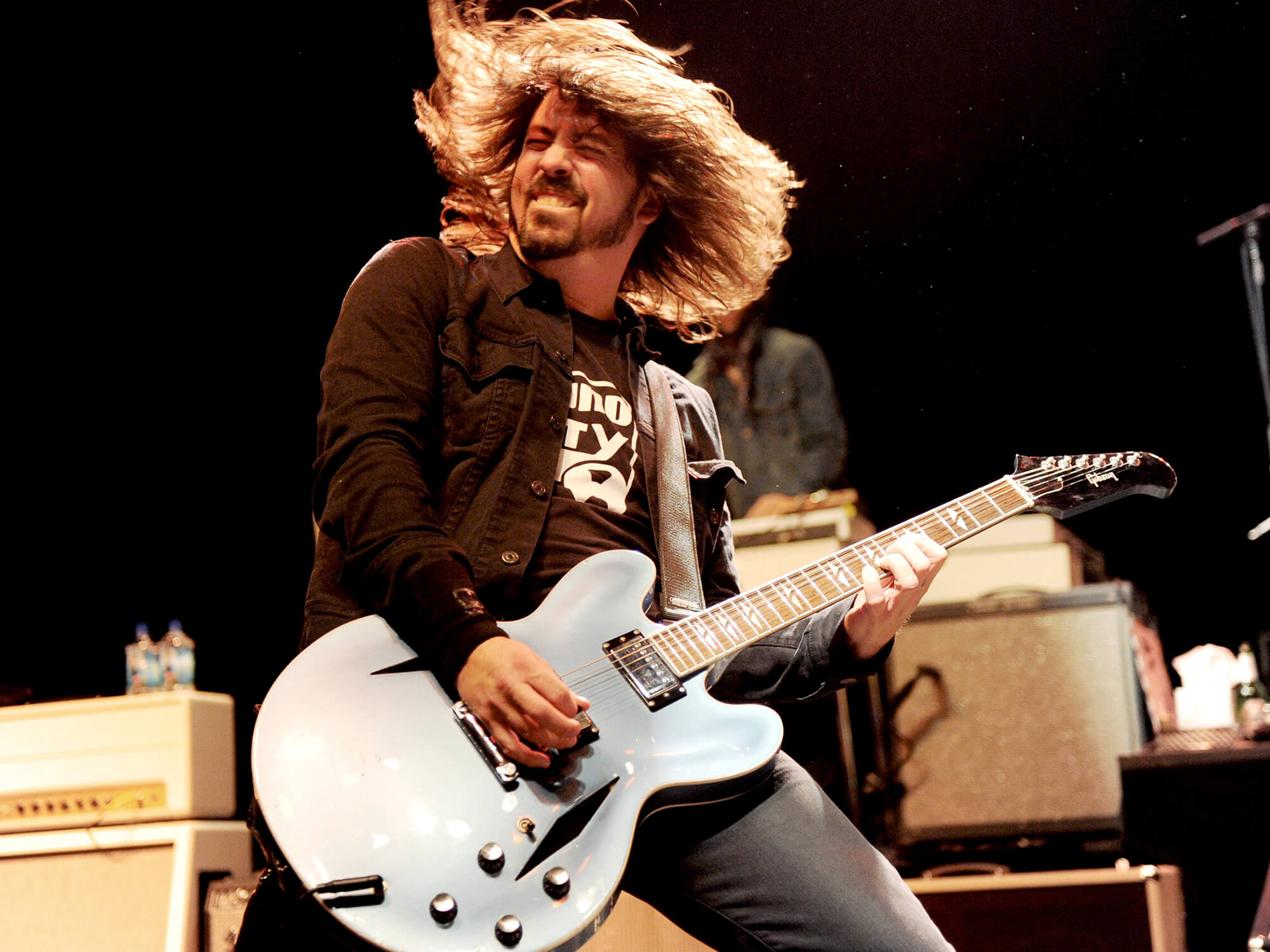 Dave Grohl performing in 2013 with his signature Gibson DG-335, photo by Kevin Winter/Getty Images