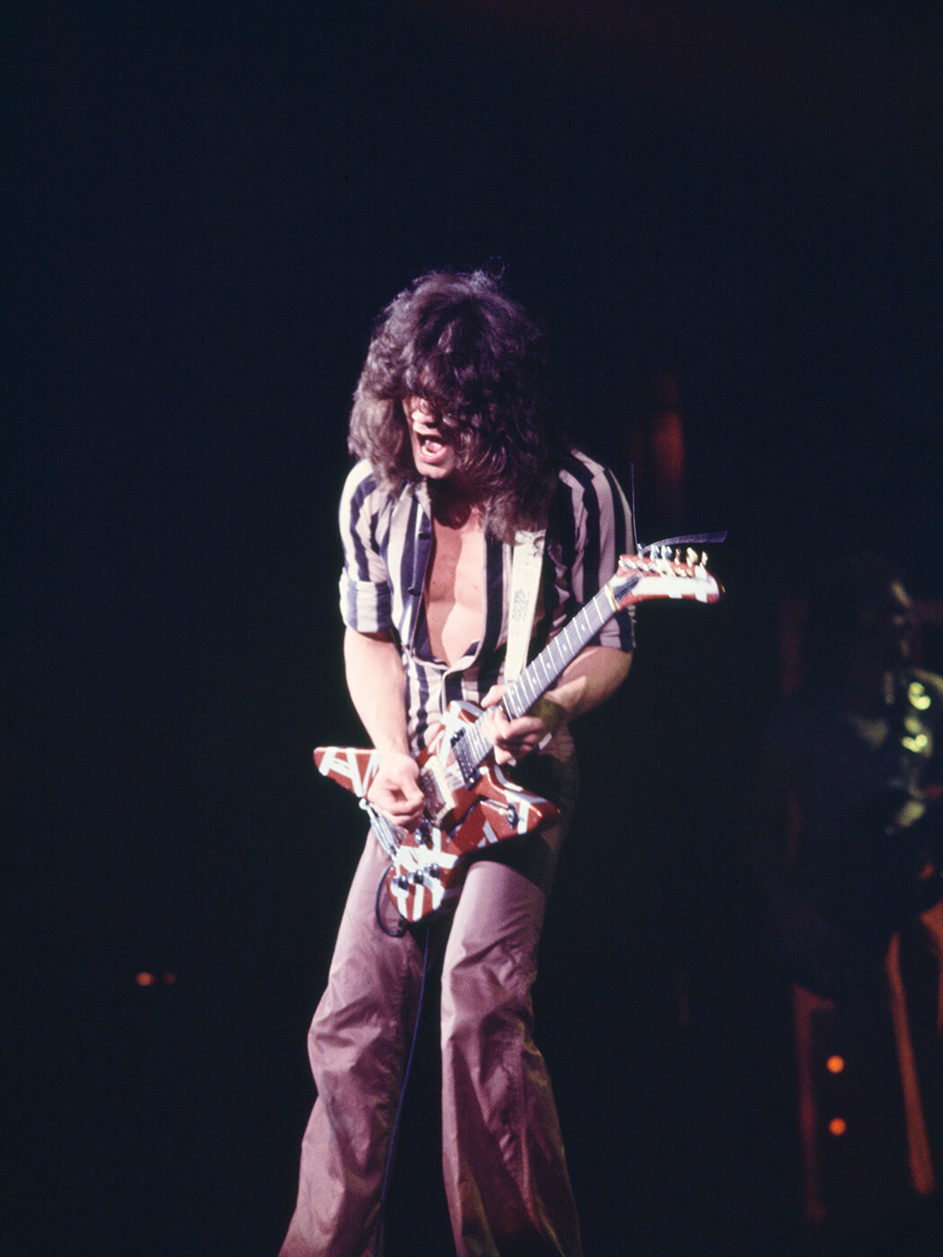 Eddie Van Halen performing during Van Halen’s first concert tour at The Palladium, New York, in 1978, photo by David Tan/Shinko Music via Getty Images